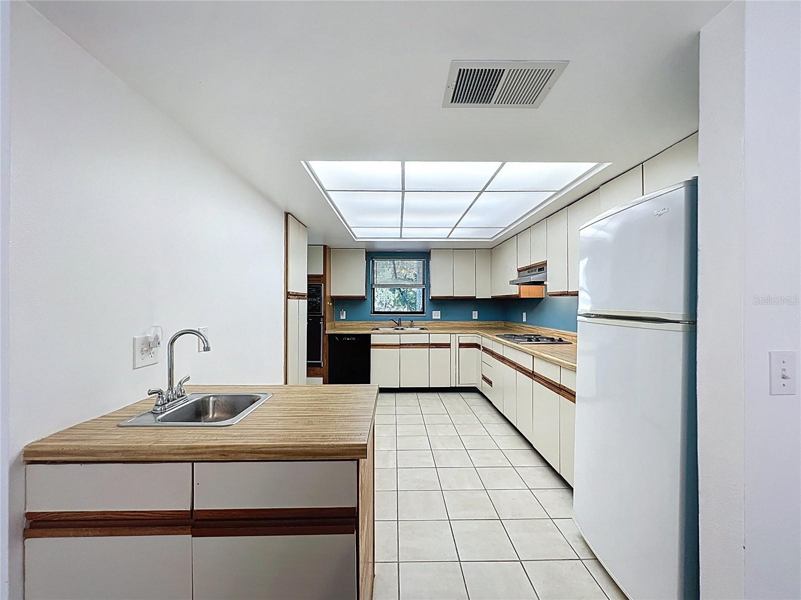 Actual kitchen - large with TWO sinks.