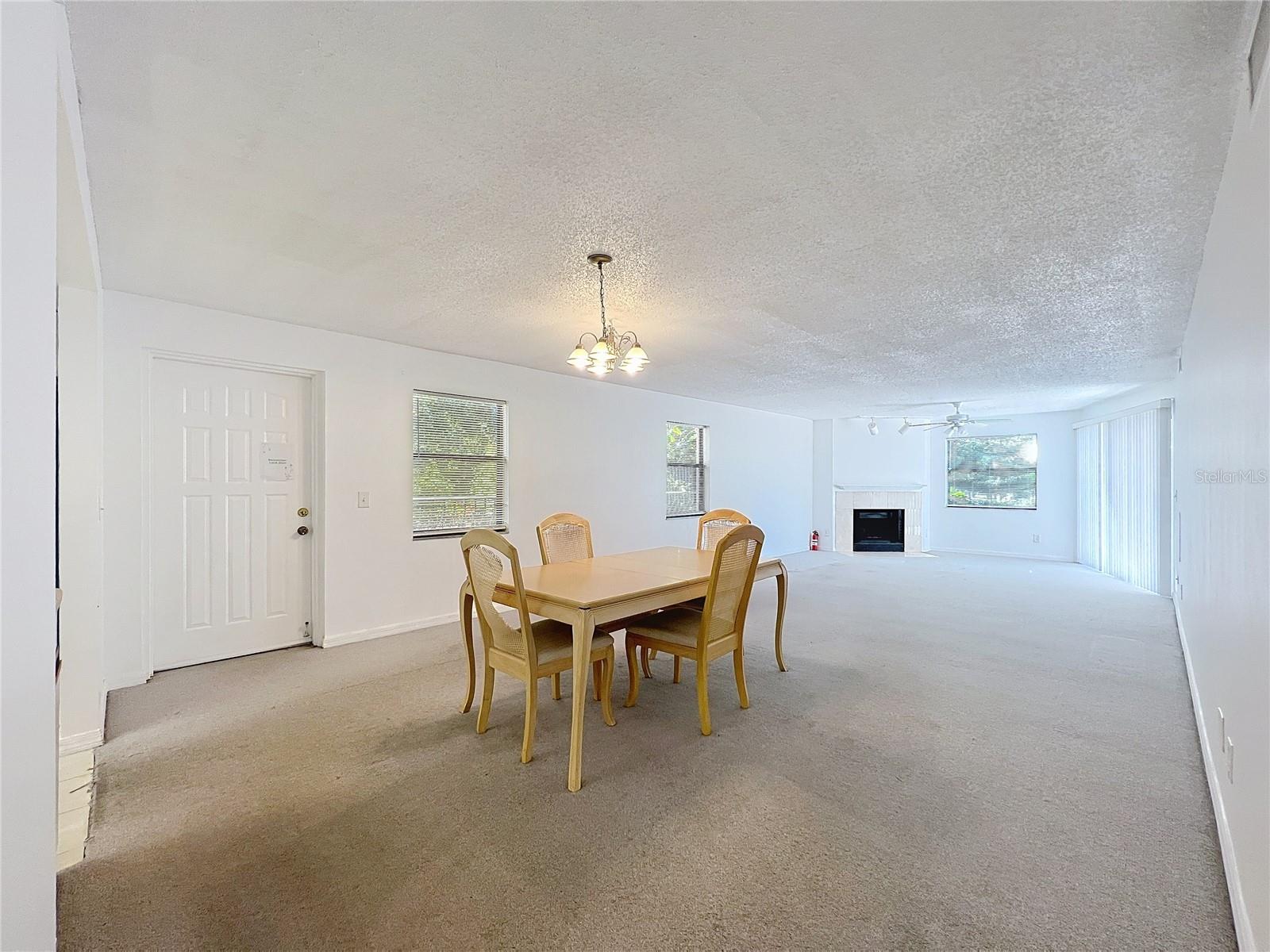 A true great room - dining room and living room leading to the screened-in patio in the back with views of the gulf.