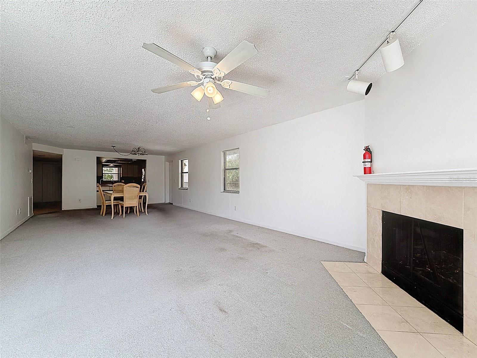 A true great room - dining room and living room leading to the screened-in patio in the back with views of the gulf.