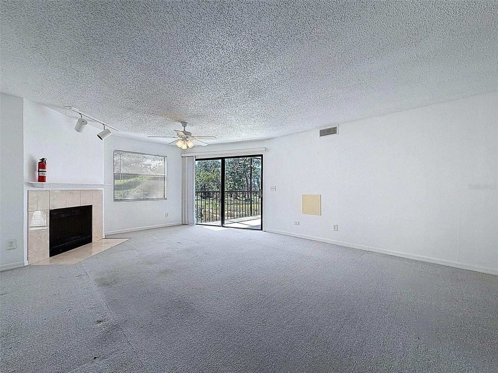 A true great room - dining room and living room leading to the screened-in patio in the back with views of the gulf.