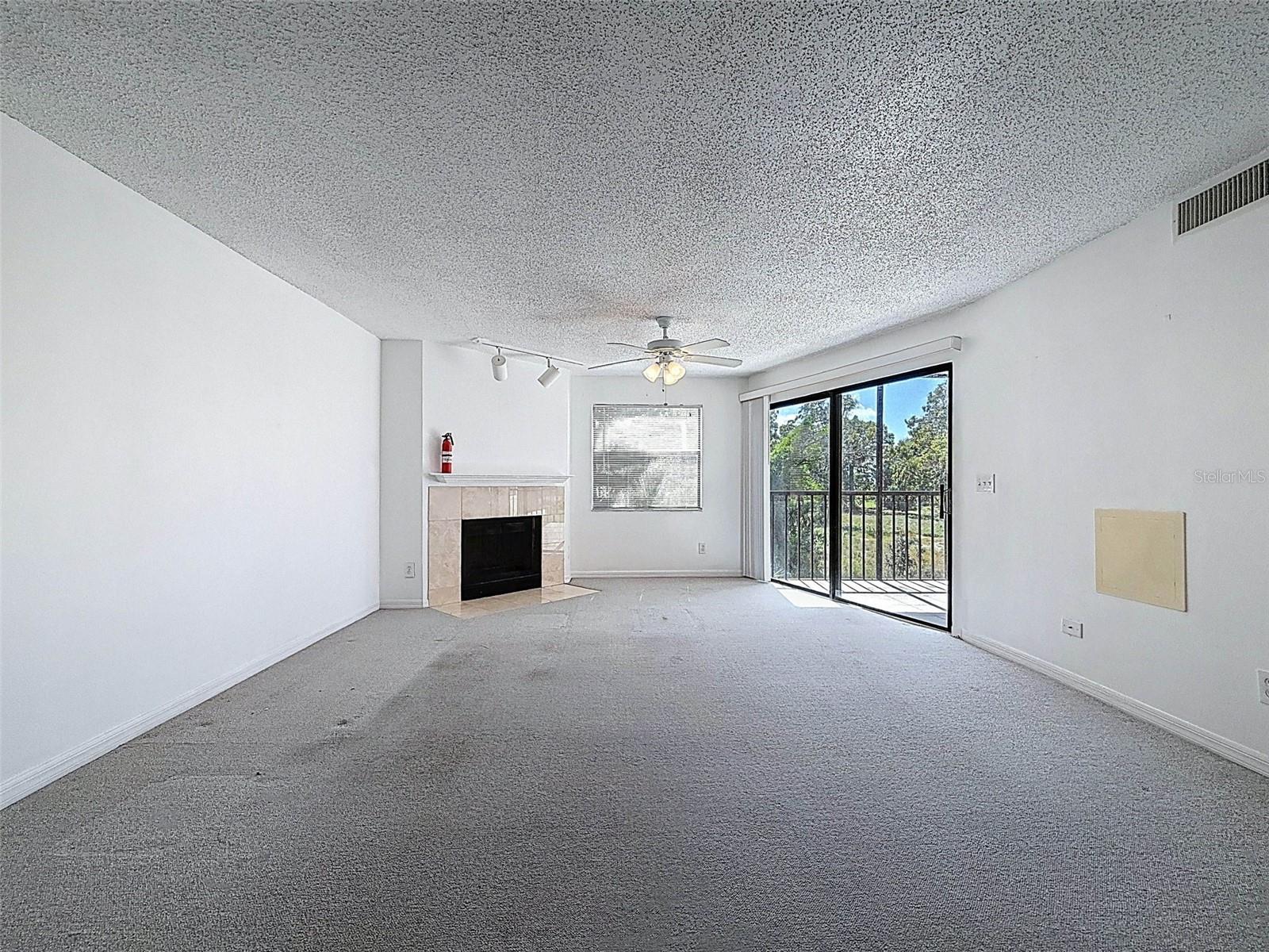 A true great room - dining room and living room leading to the screened-in patio in the back with views of the gulf.