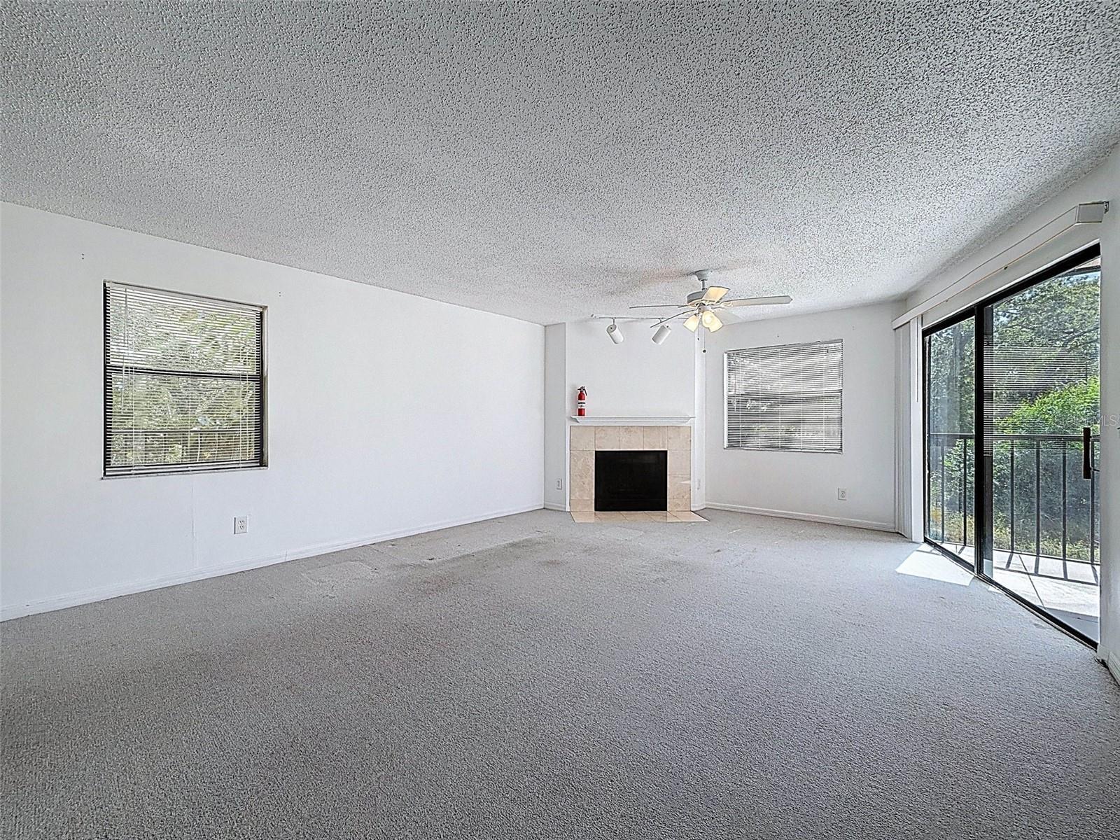 A true great room - dining room and living room leading to the screened-in patio in the back with views of the gulf.