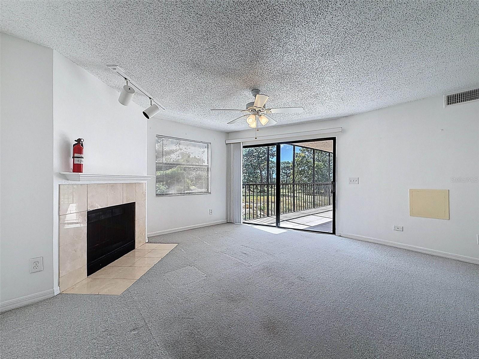 A true great room - dining room and living room leading to the screened-in patio in the back with views of the gulf.