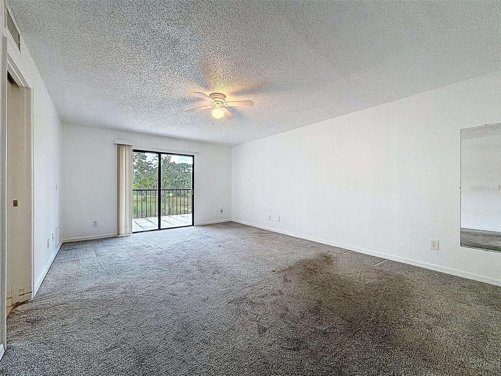 Master bedroom with access to the screened-in patio.