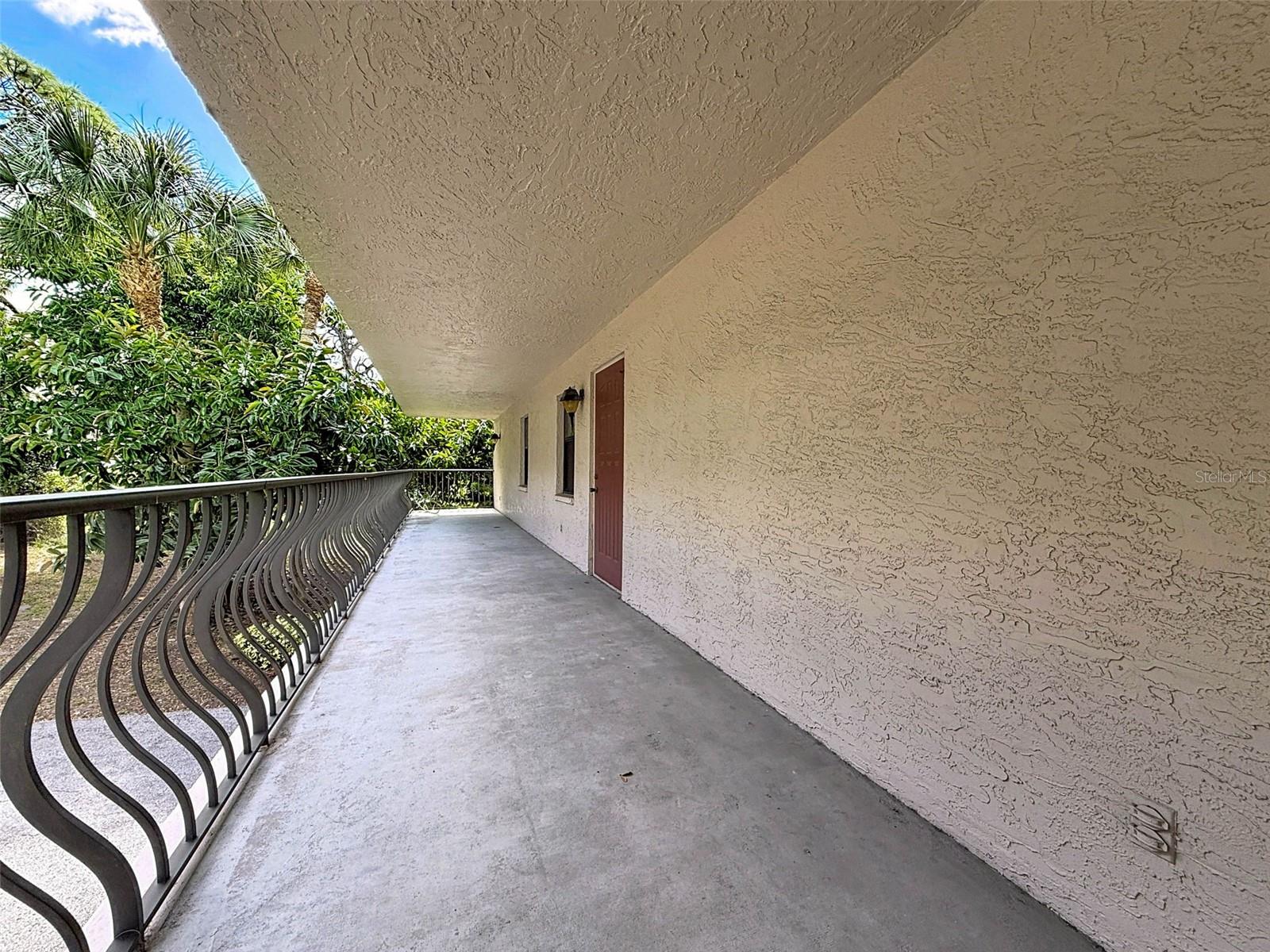 1 of 3 private, covered patios. This one is at the side.