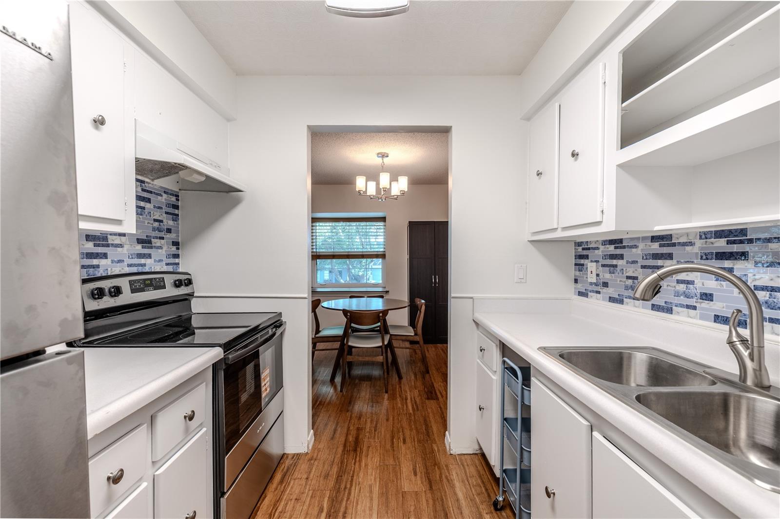 The kitchen is open to the dining room