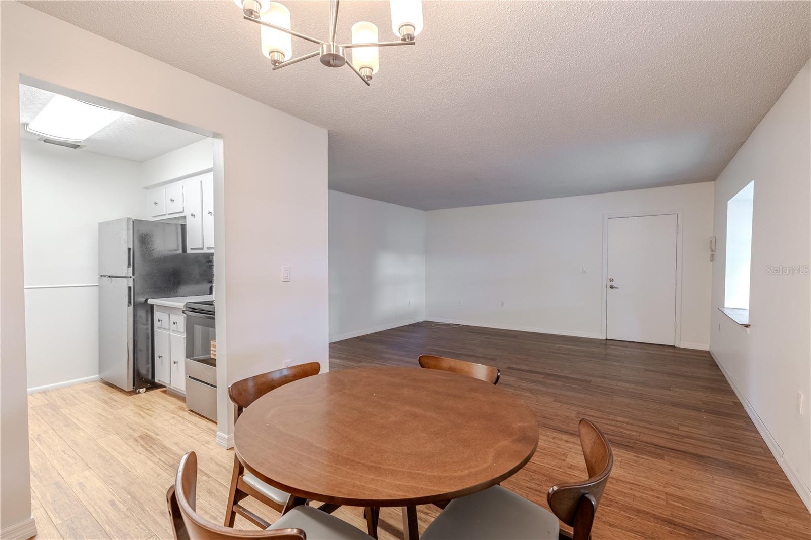 There's a seamless flow between the kitchen, dining, and living areas, creating an inviting and functional layout.
