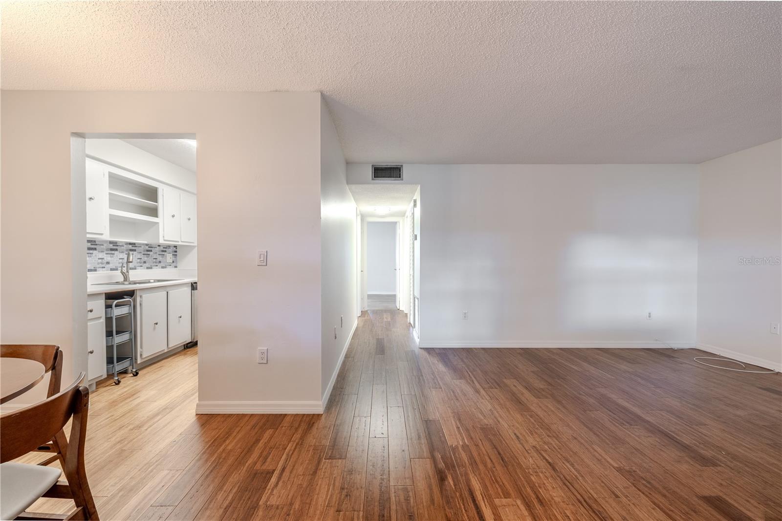 There's a seamless flow between the kitchen, dining, and living areas, creating an inviting and functional layout.