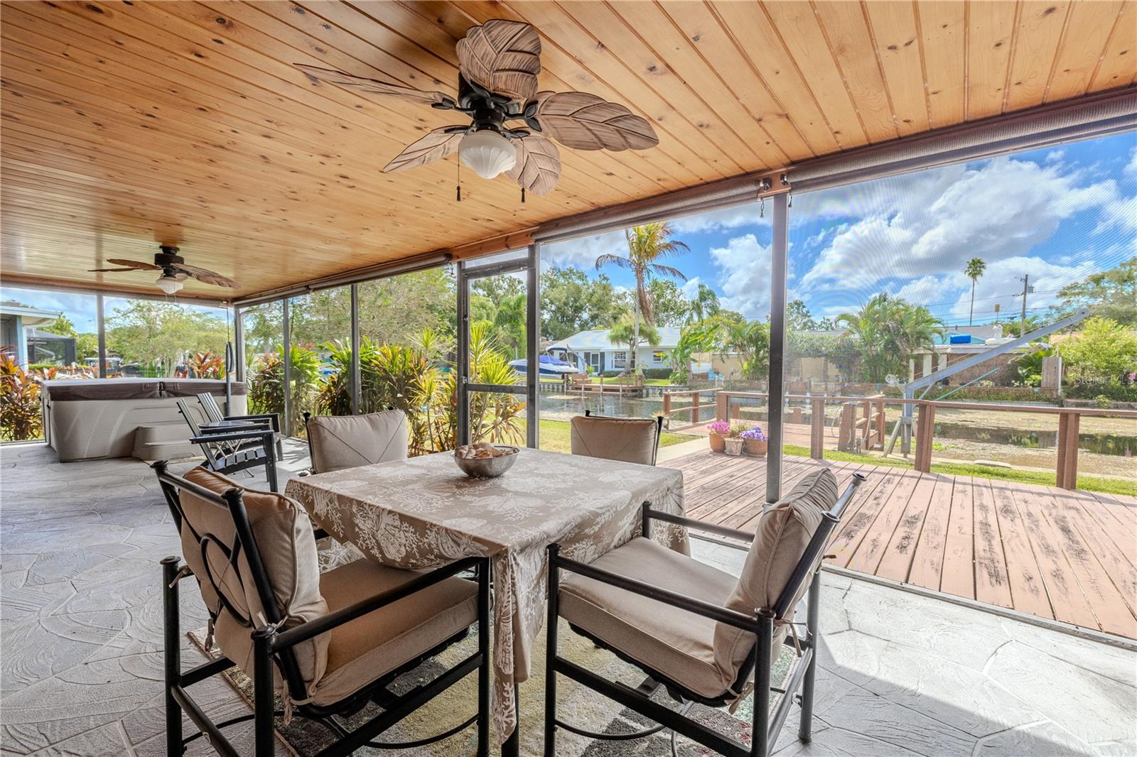 Back screened in back patio with ceiling fans to keep you cool year round!