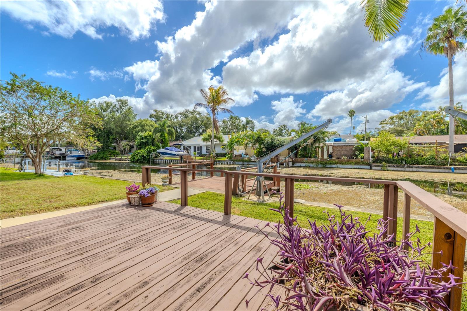 Wide canal view showcasing the peaceful setting and waterfront lifestyle.