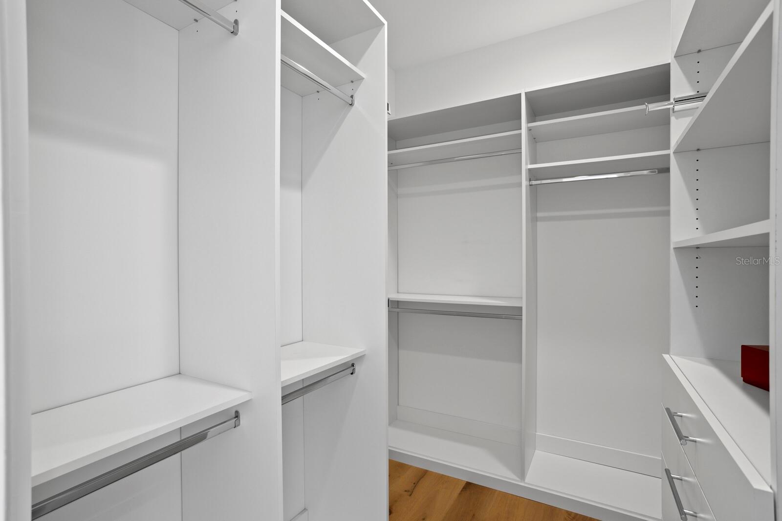 This is one of two large walk-in closets.