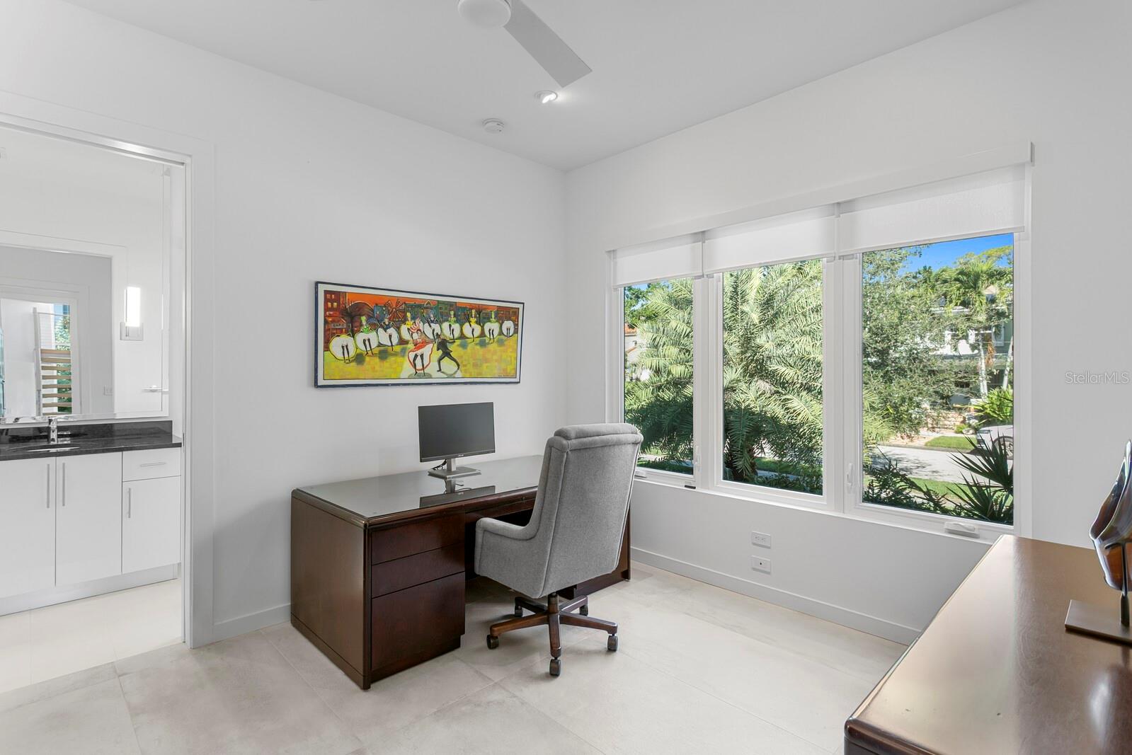 This downstairs bedroom suite is currently used as an office.