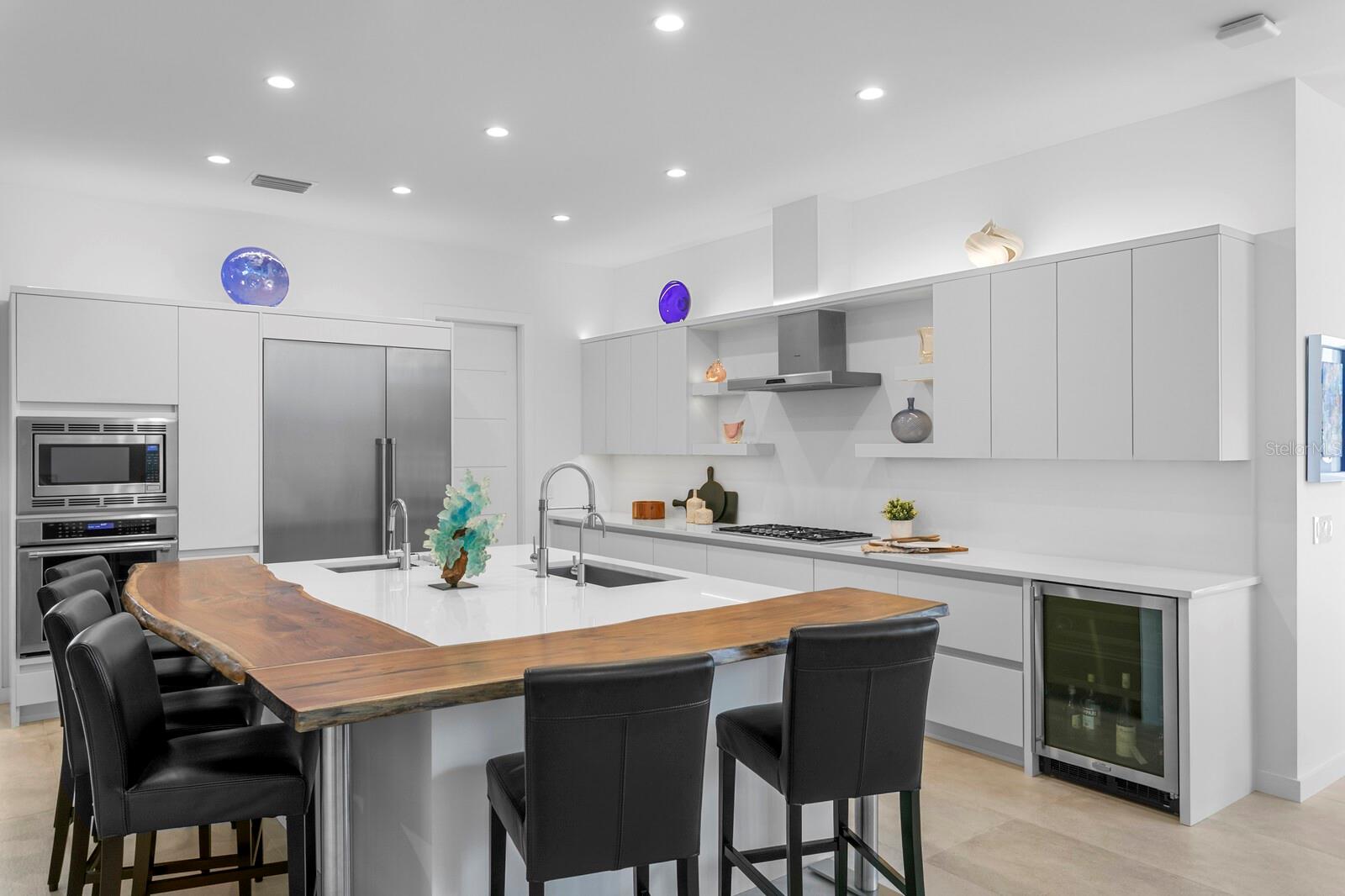 A live edge wood dining counter adds warmth.
