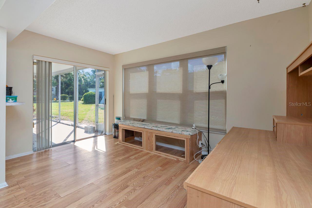 Additional living area adjacent to dining area and beyond to patio