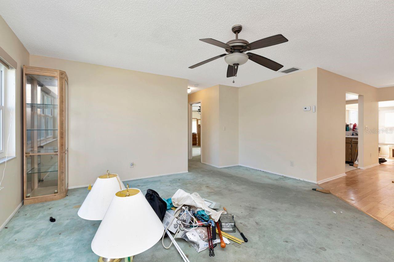 Living room looking towards bedrooms to the left and kitchen and dining to the right
