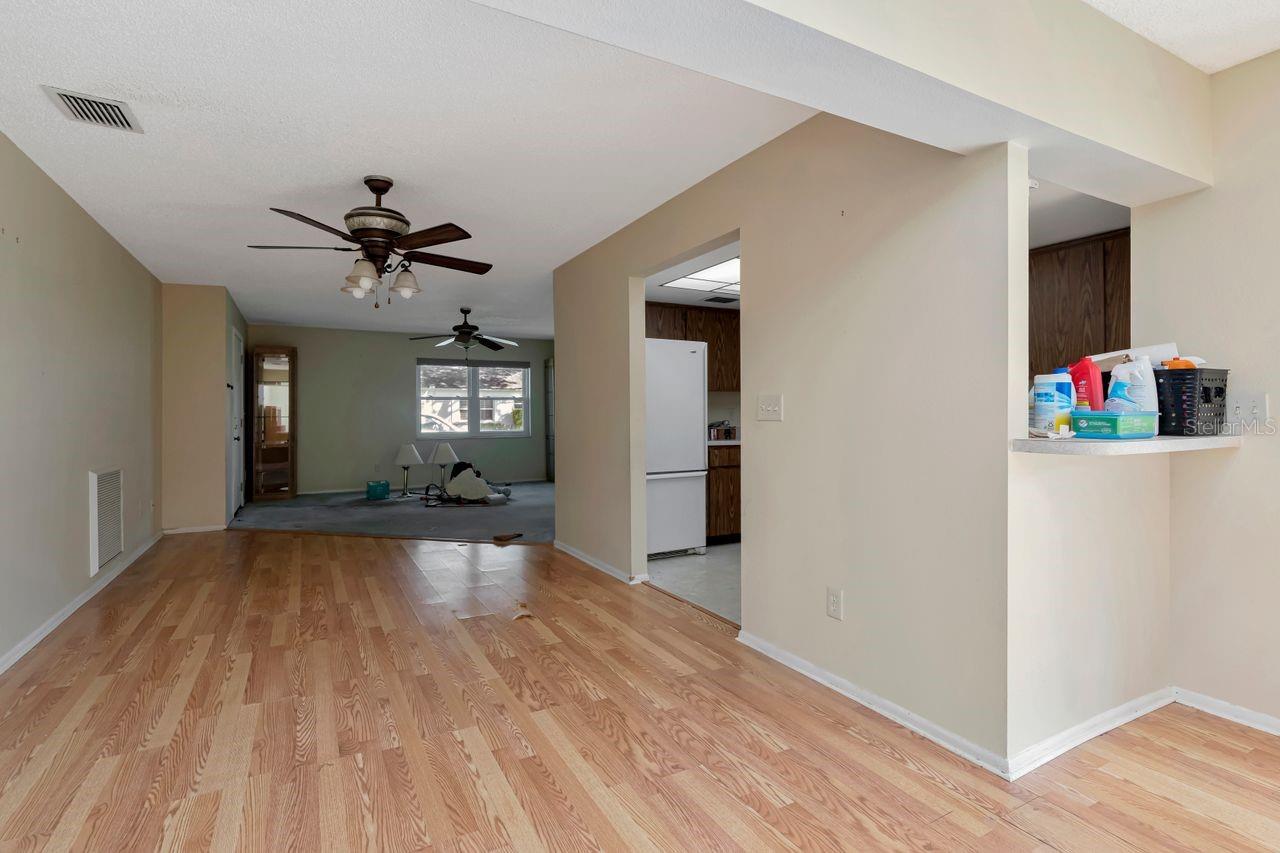 Dining area looking into kitchen and living room