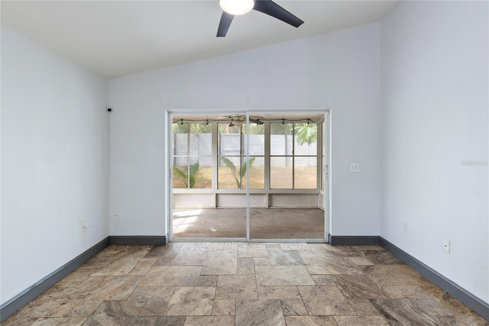 Family room looking out to enclosed screened patio