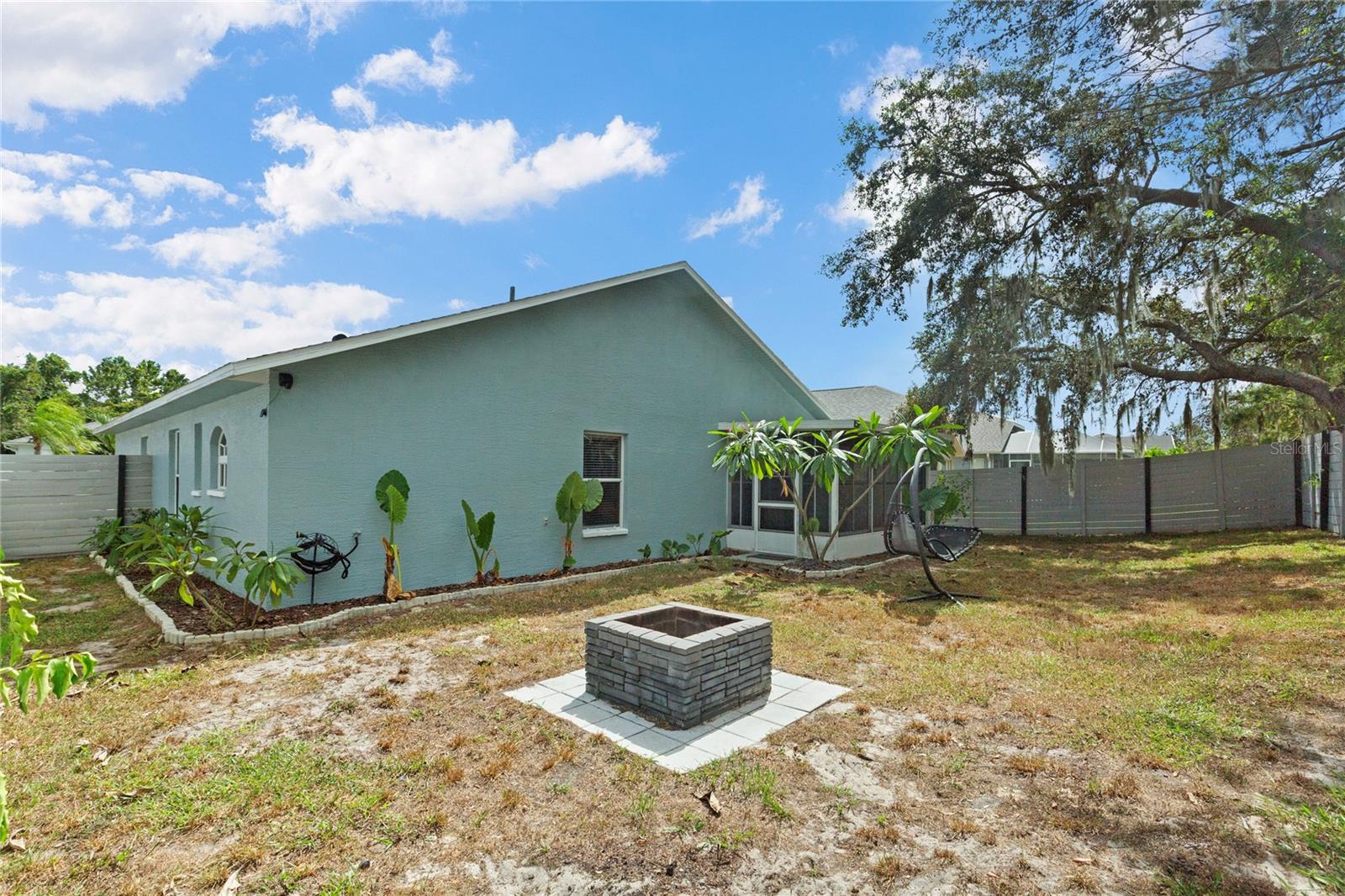Fenced in Backyard with firepit