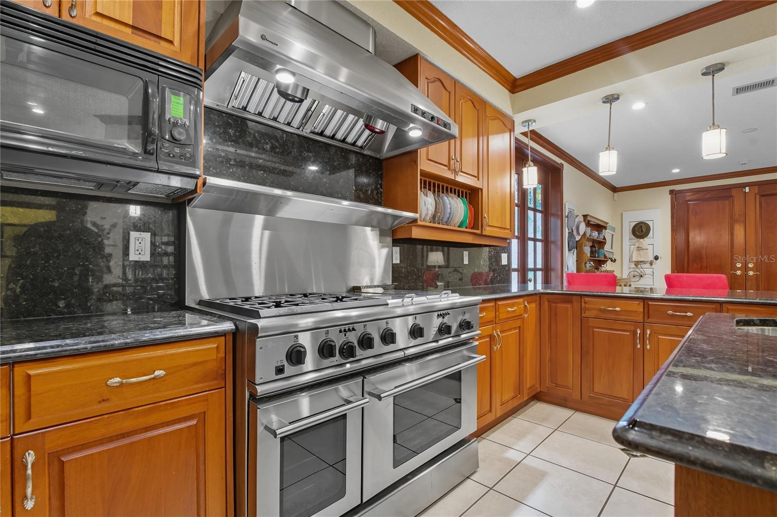 PROFESSIONAL 48" GE MONOGRAM NATURAL GAS RANGE! THE CHEF OF THE HOME WILL LOVE COOKING HERE!