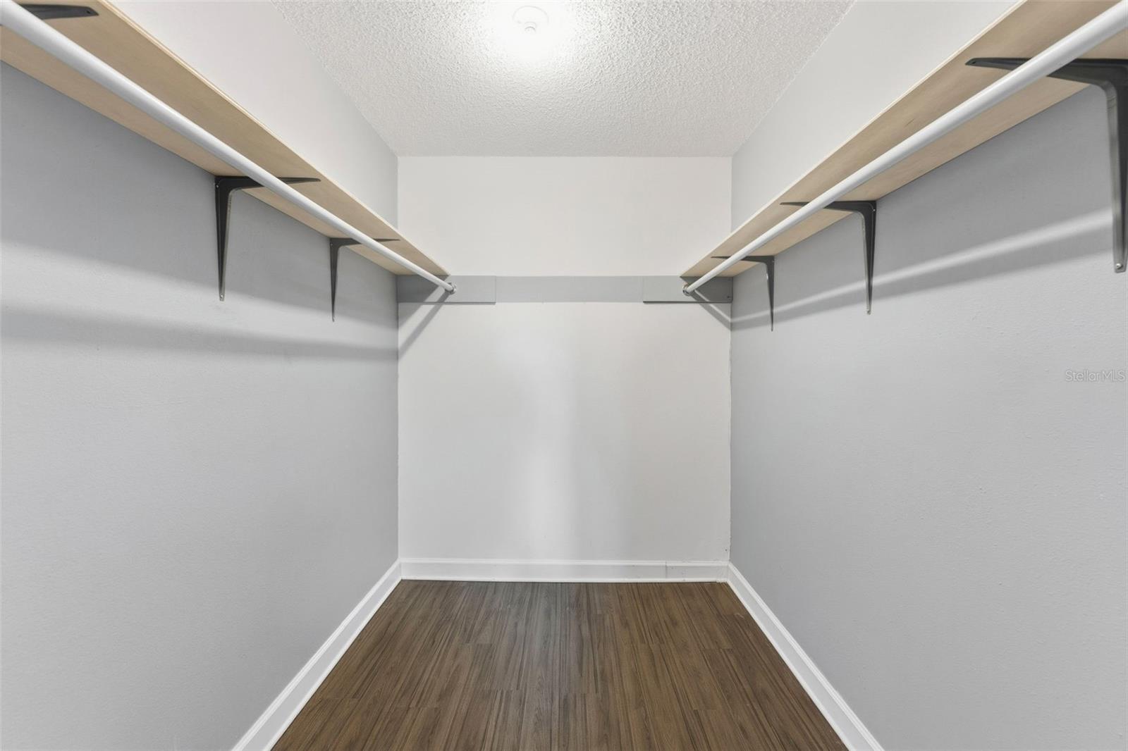 Primary bedroom walk in closet