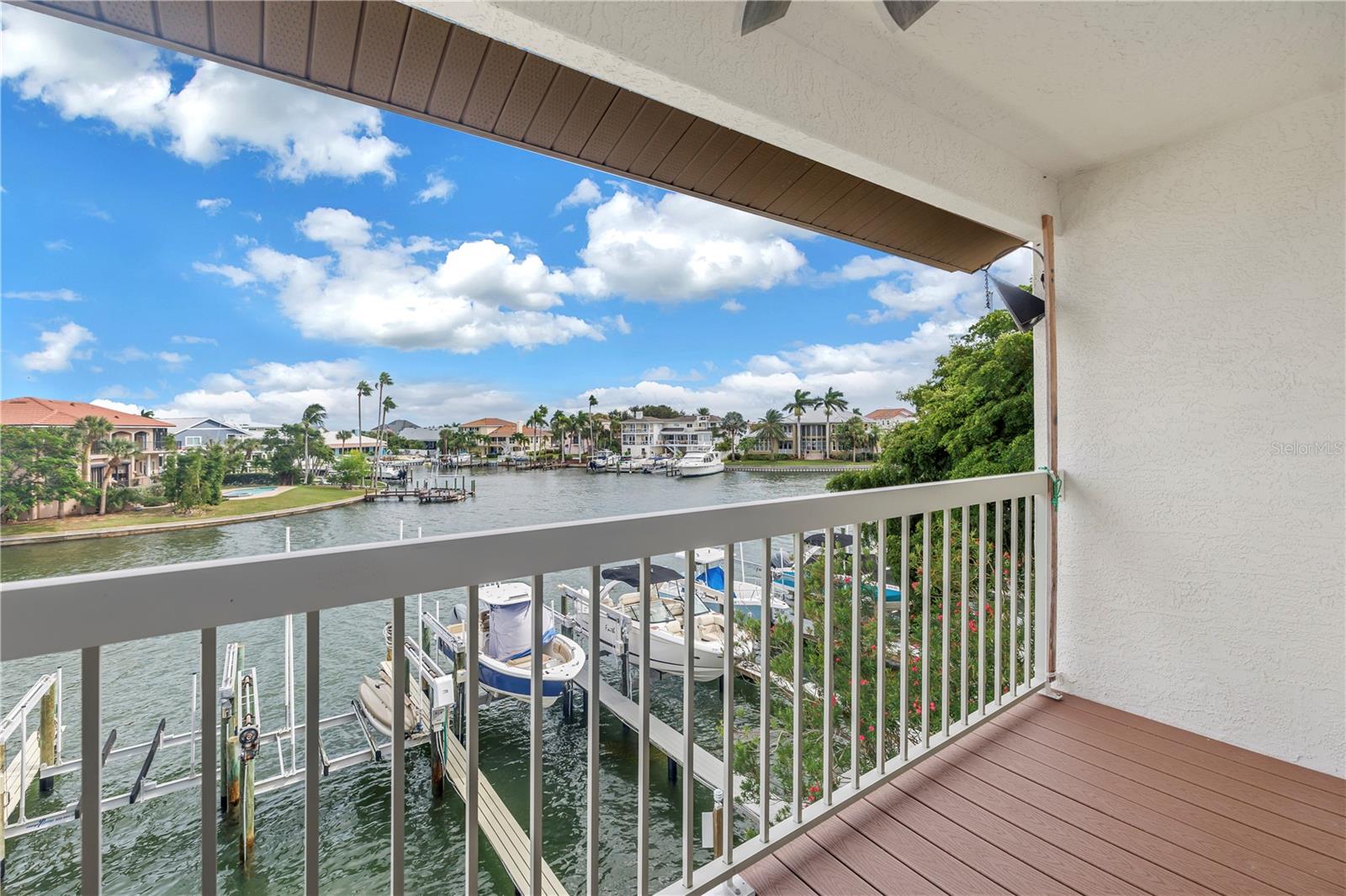 Balcony in the primary bedroom overlooks the water