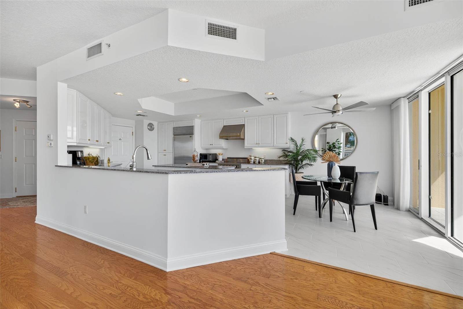 Kitchen overlooks the living room with sliders that lead to your terrace from the kitchen and sliders from the living room.