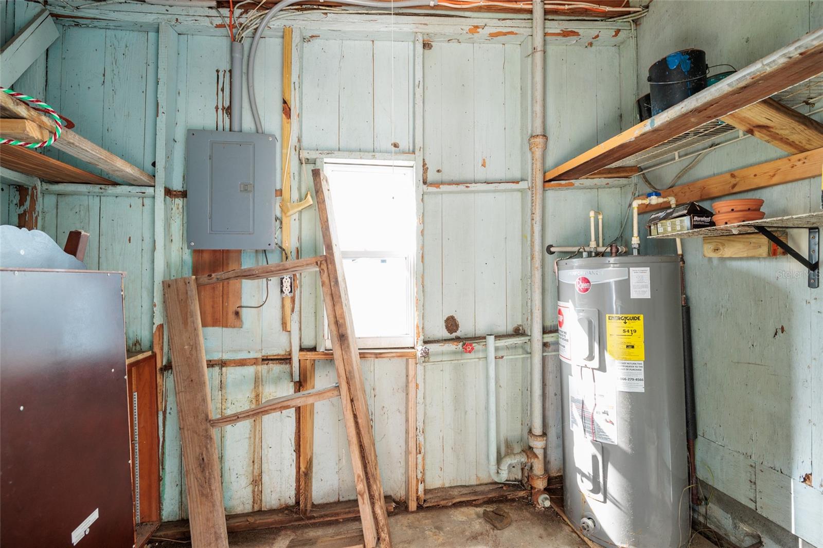 Outside laundry room. New water heater. Space for storage