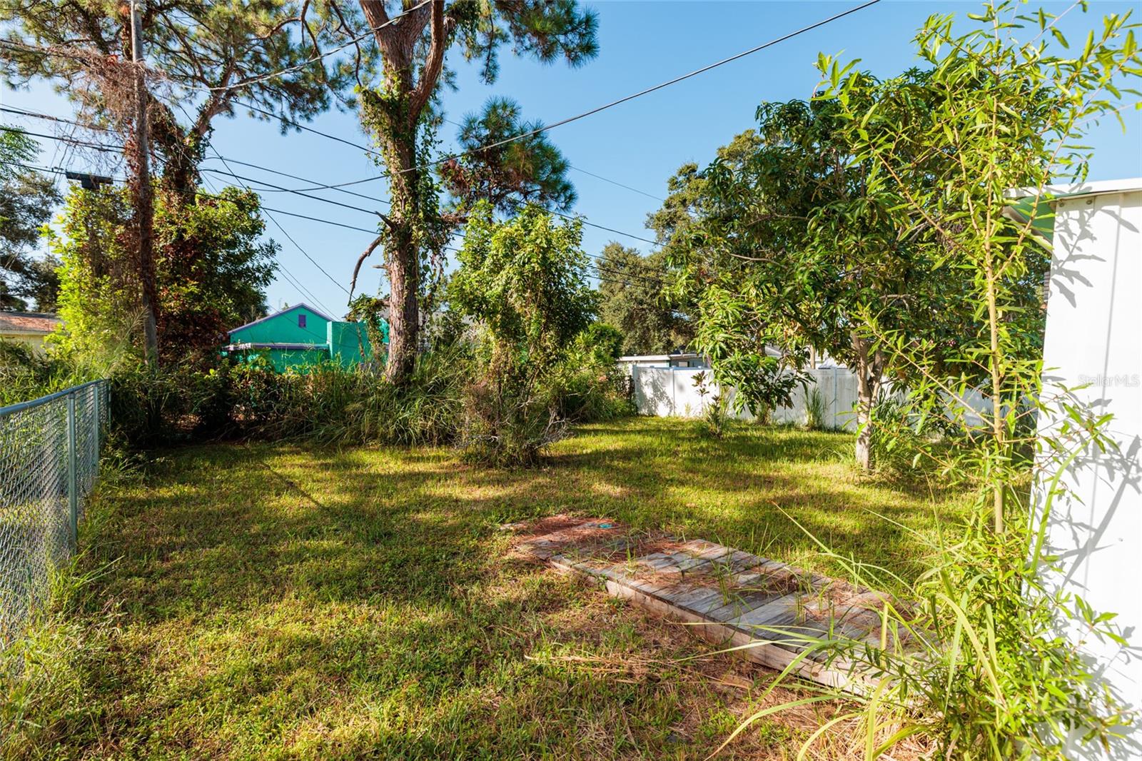 Large fenced backyard. Photo facing south.
