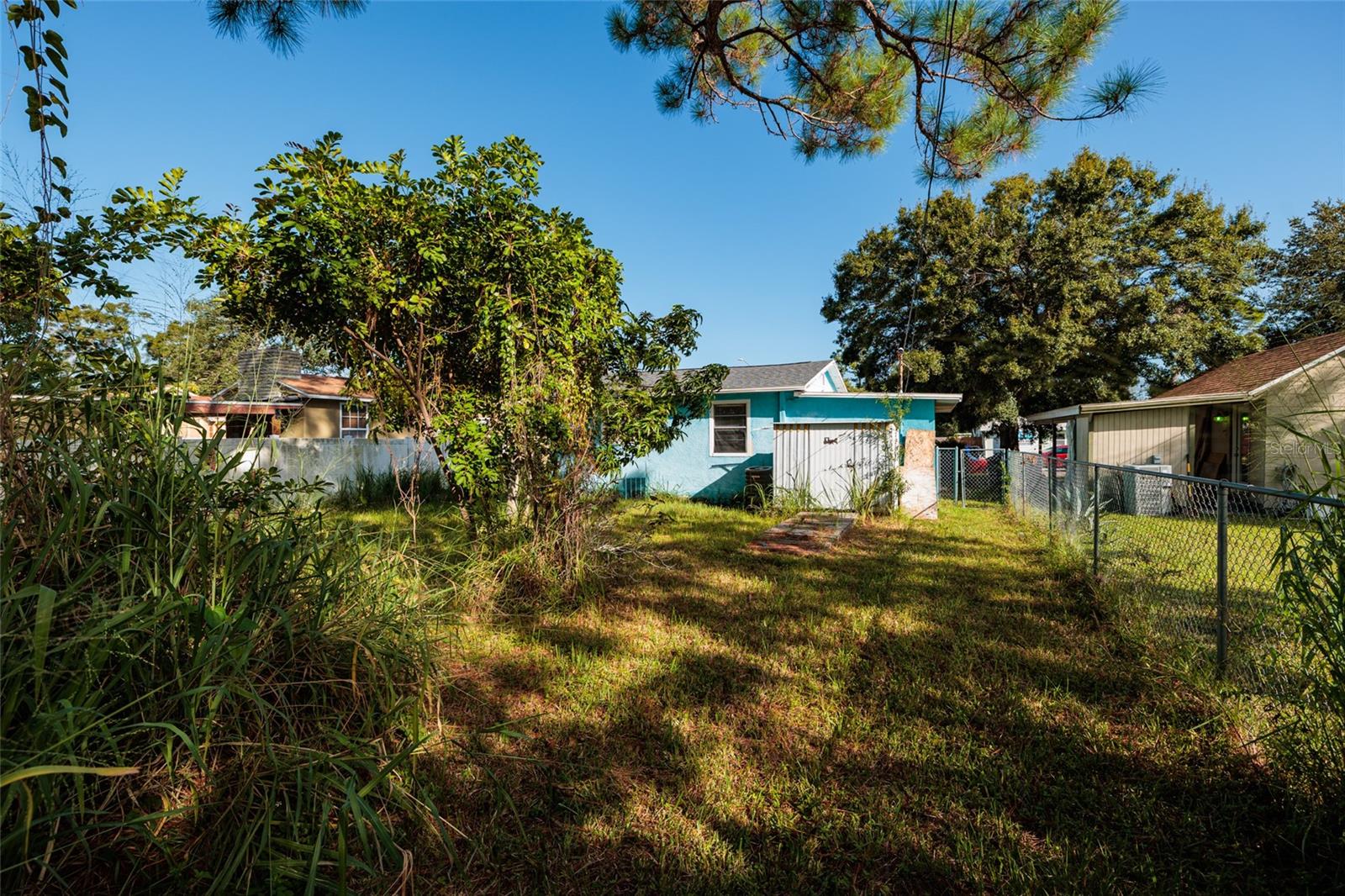 View of backyard toward house- has outside shed