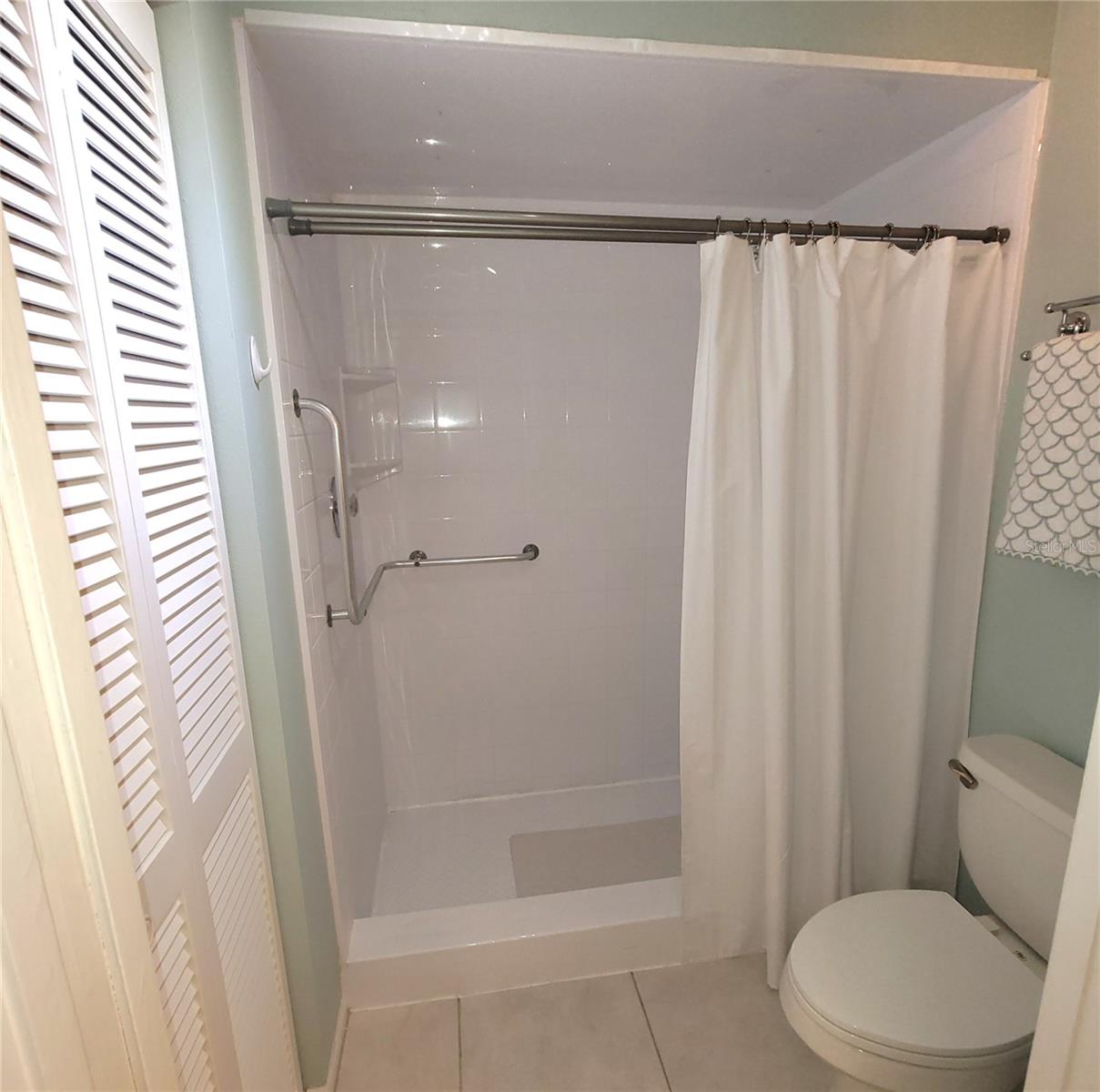 Primary Bathroom with Walk-In Shower and Linen Closet