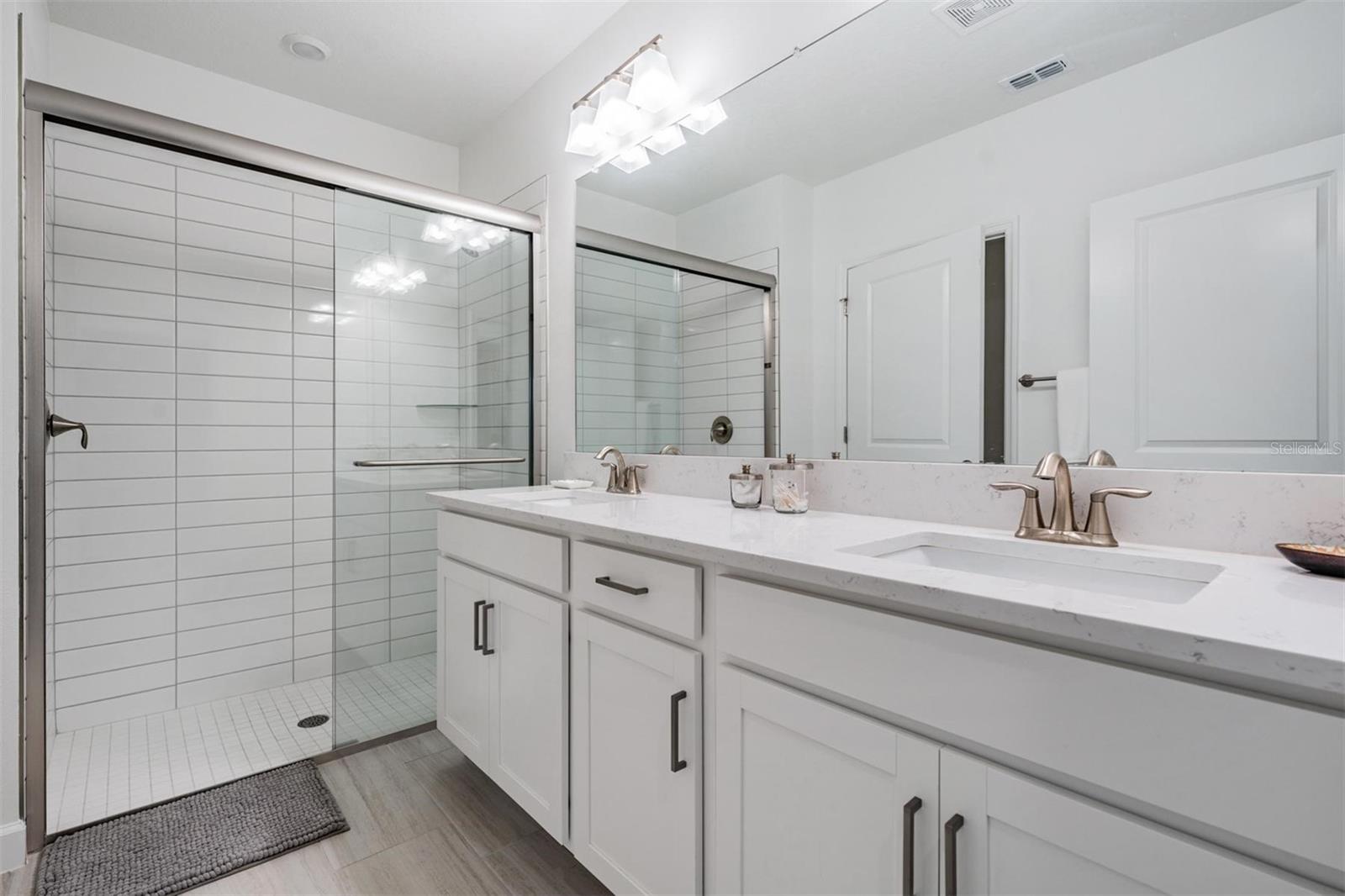 Dual sinks and large walk-in shower
