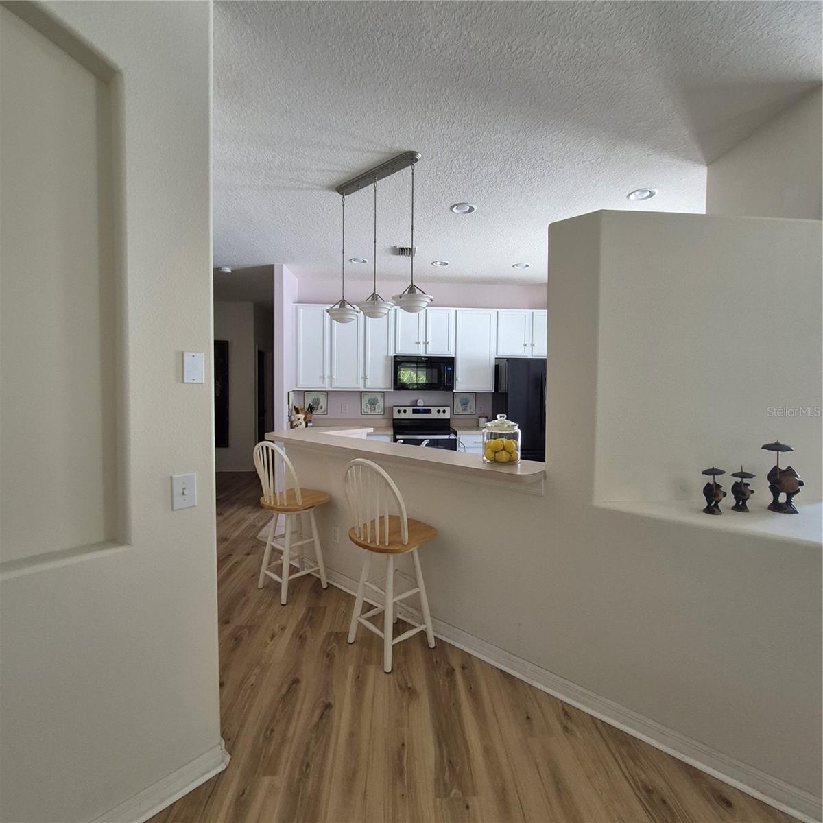 hallway leading to Kitchen & dining area