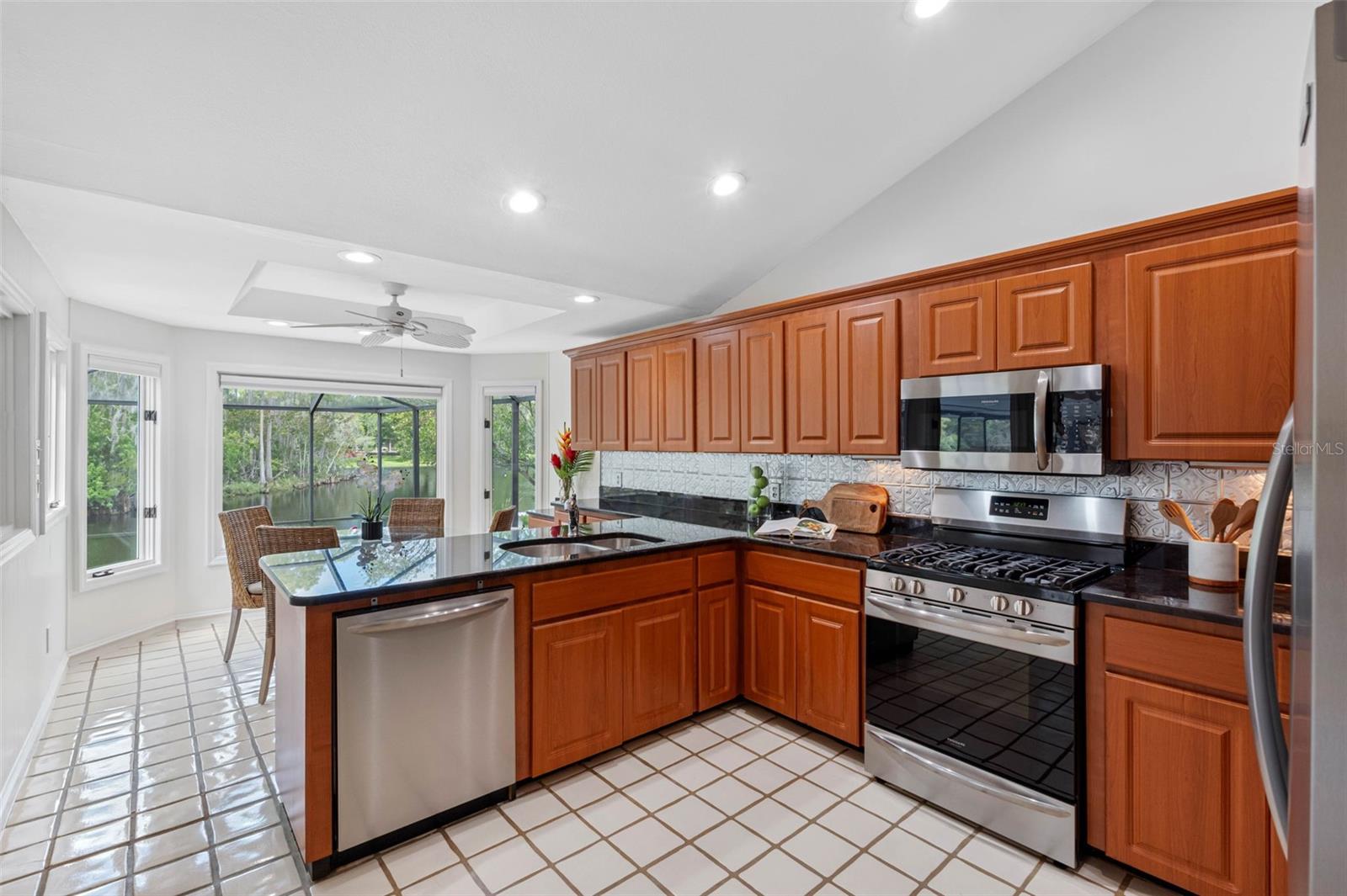The kitchen has a vaulted ceiling