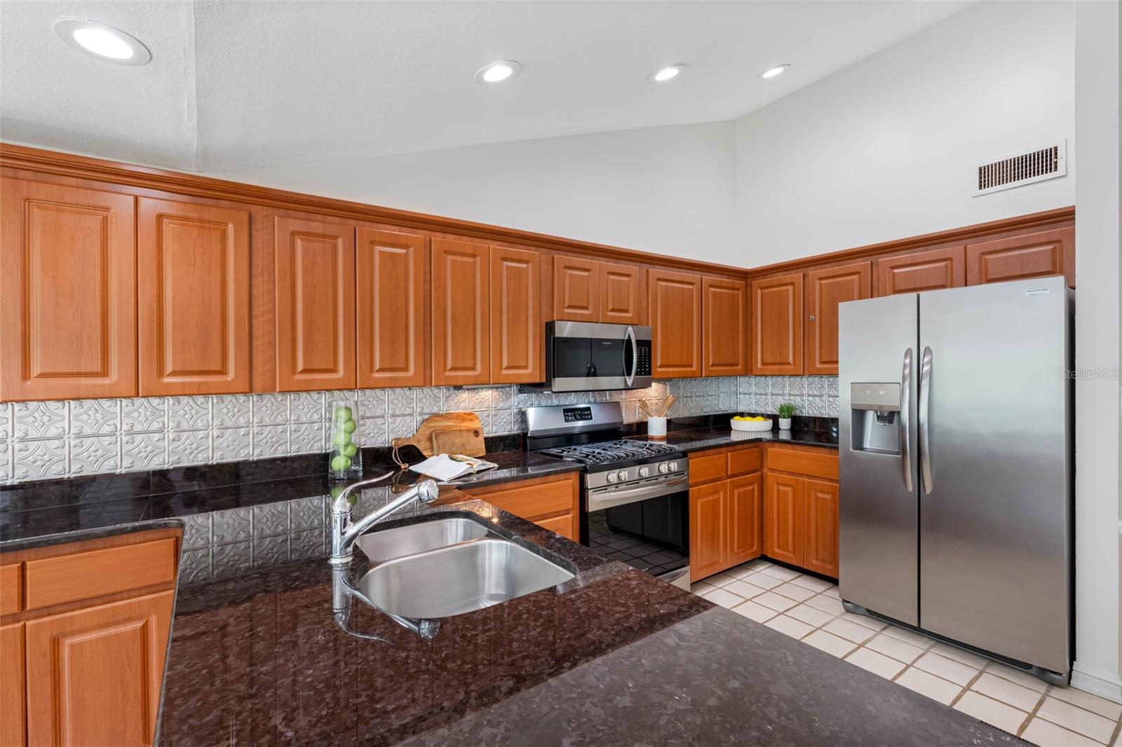 Lots of cabinetry and granite countertops