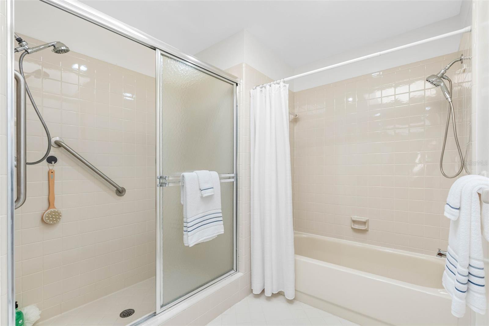 Primary Bathroom has a tub and separate walk-in shower