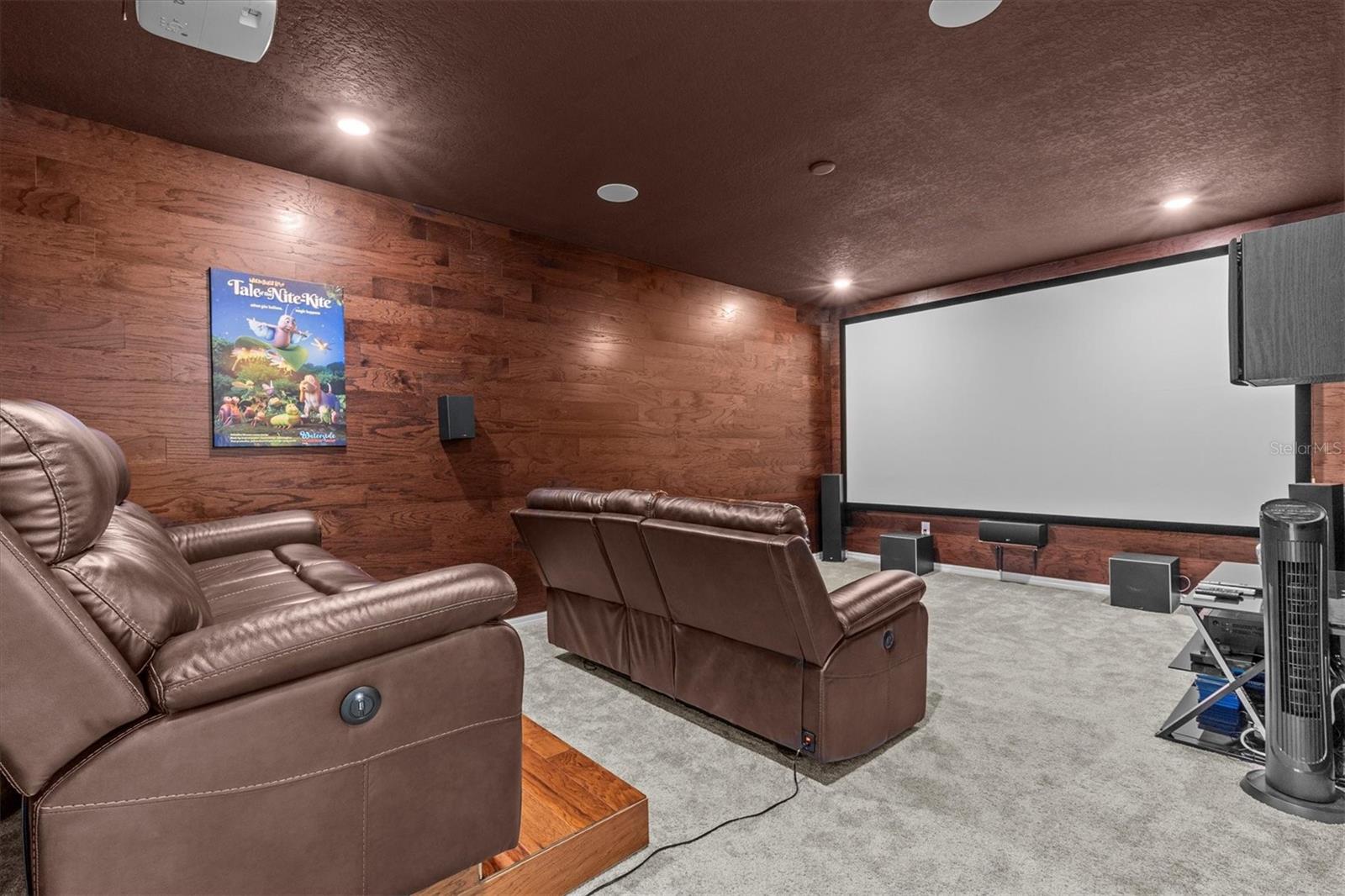 Movie Room, complete with Wood Panel Walls. Projector, Screen and Chairs included!