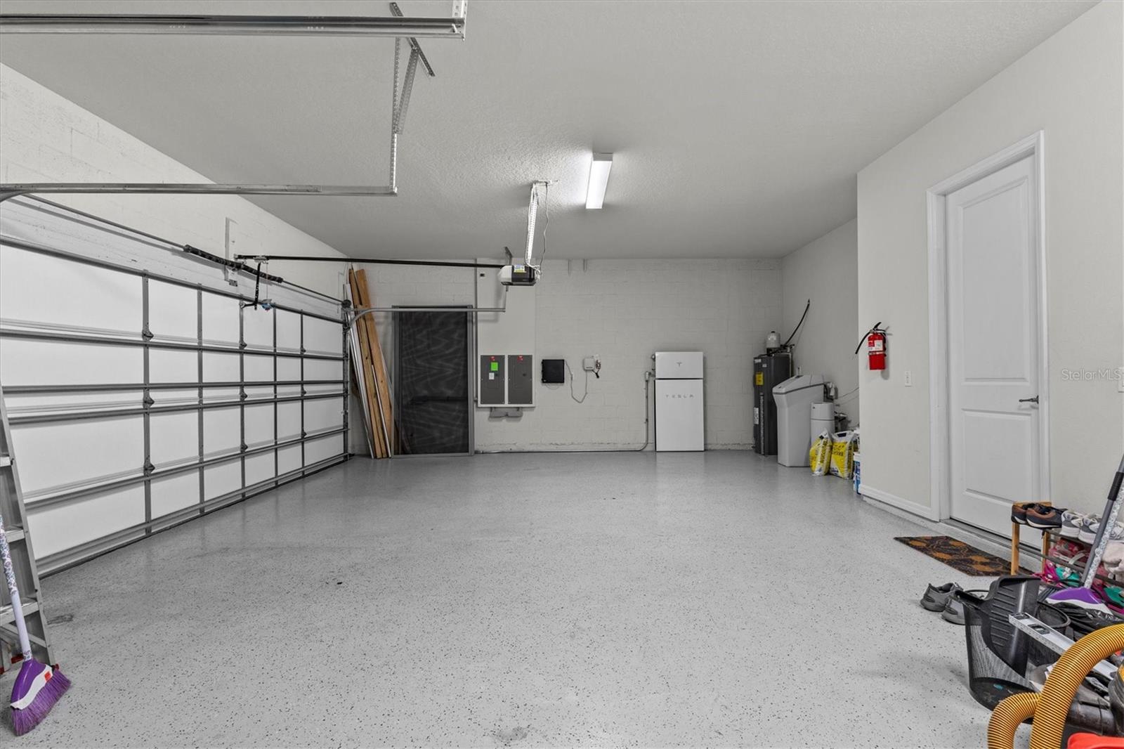 3 Car Garage with Additional Storage Space, and Tesla Solar Wall