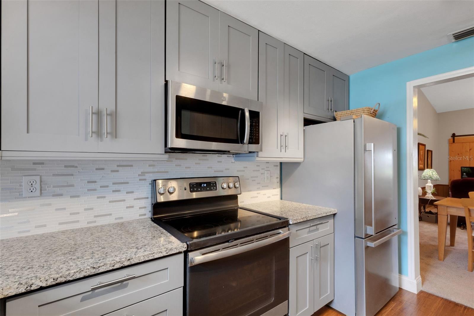 To the Ceiling Cabinets & Stylist backsplash