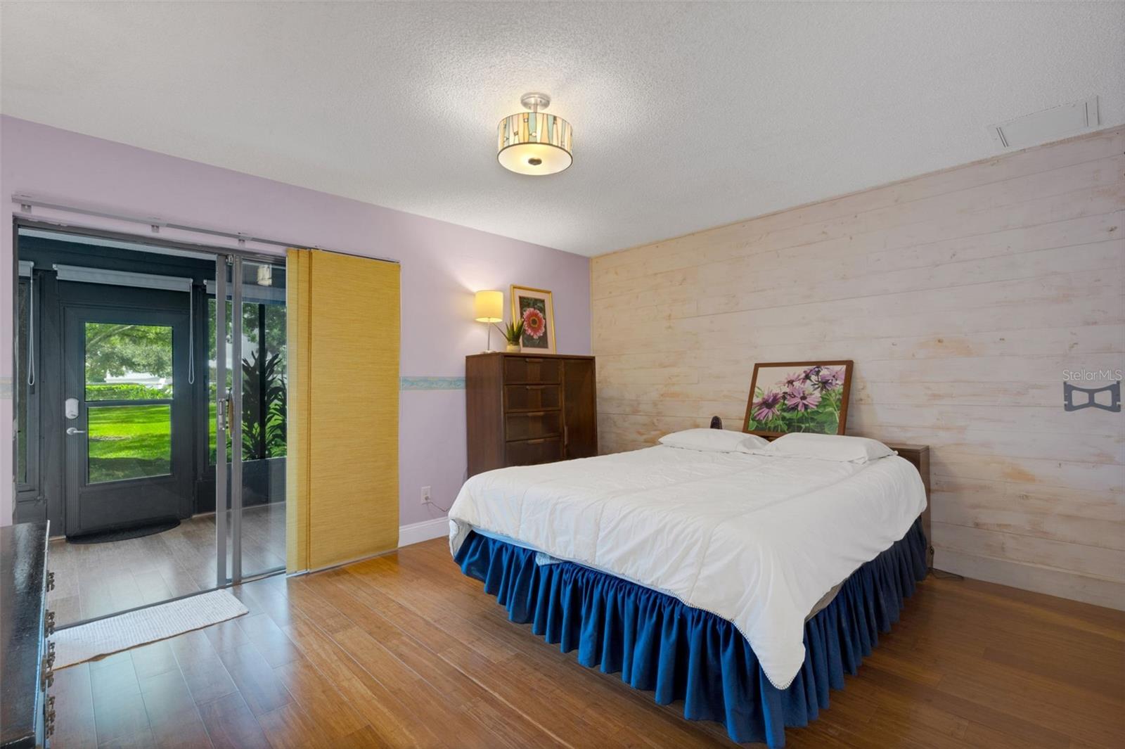 Large Primary bedroom with engineered wood floors