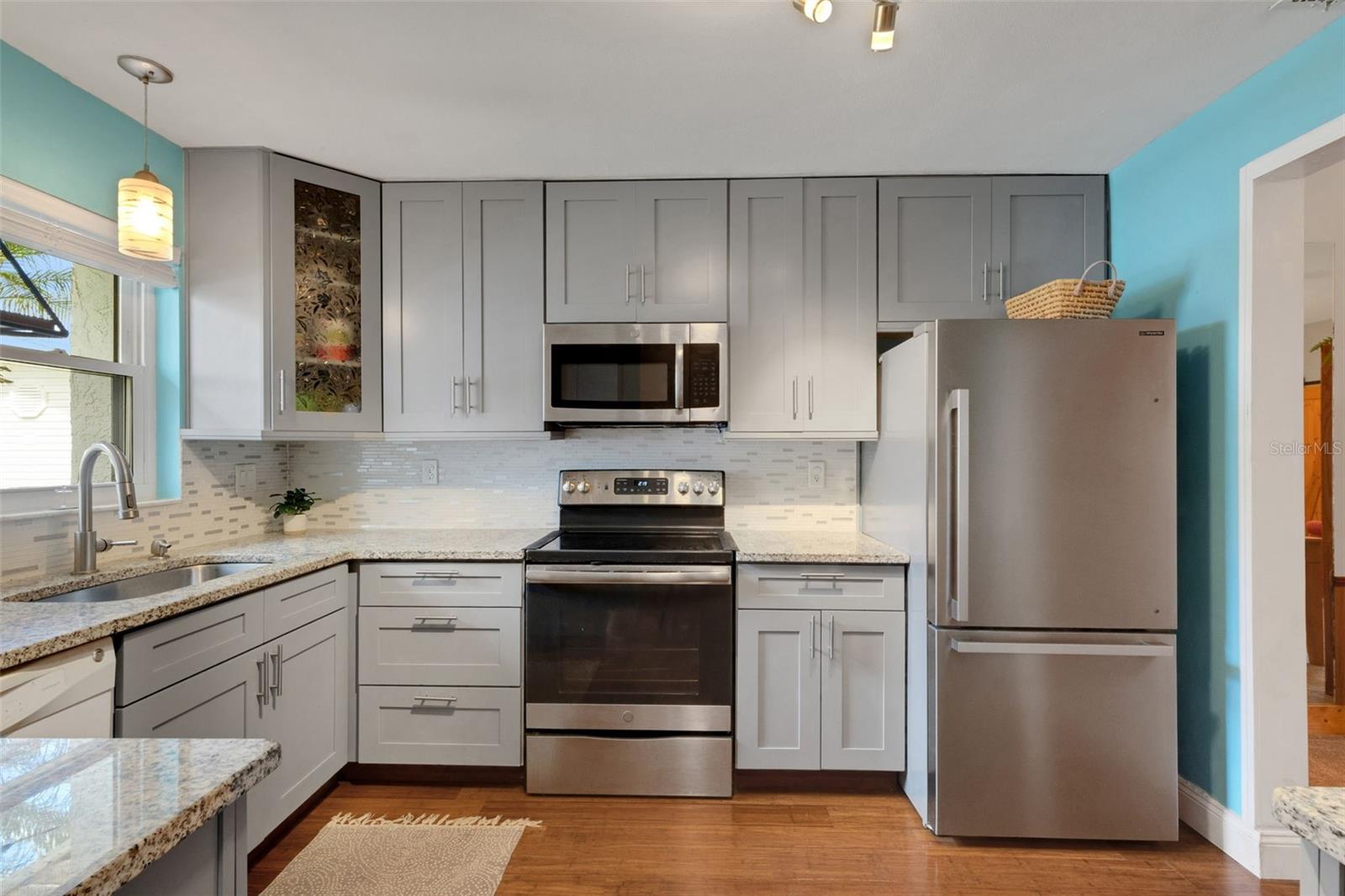 Updated Kitchen, granite countertops, SS range and fridge.
