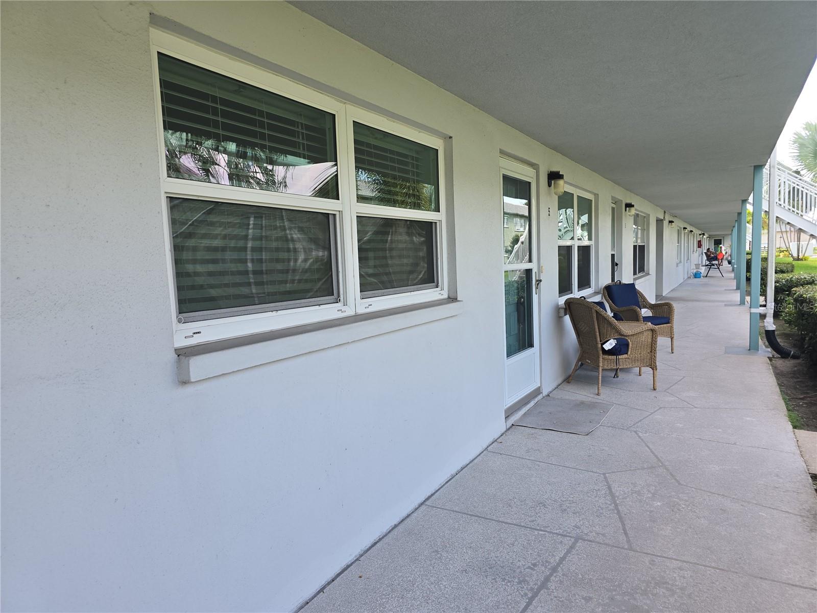 Front of the unit with the outdoor chairs