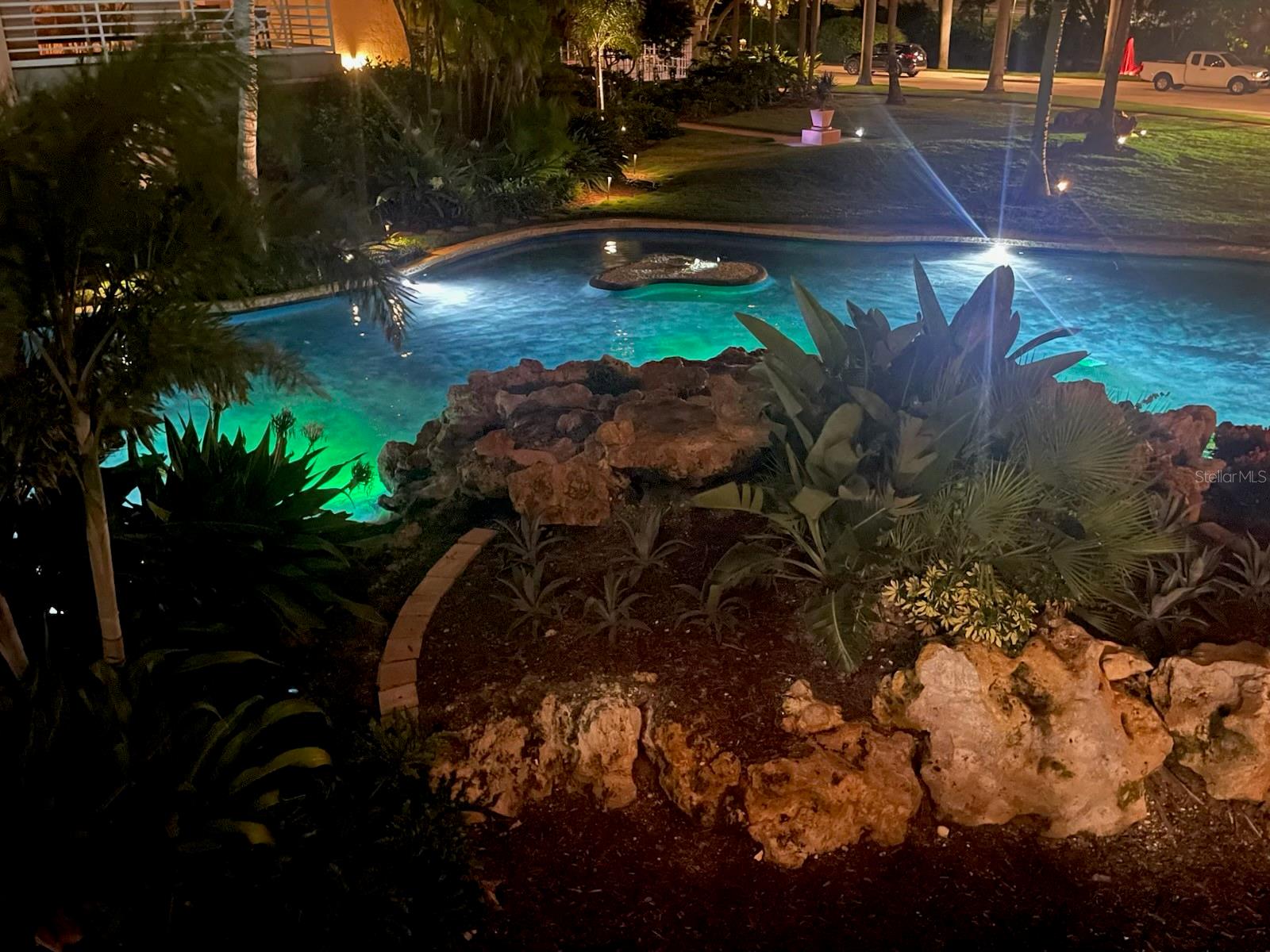 Night shot of pond next to Condo