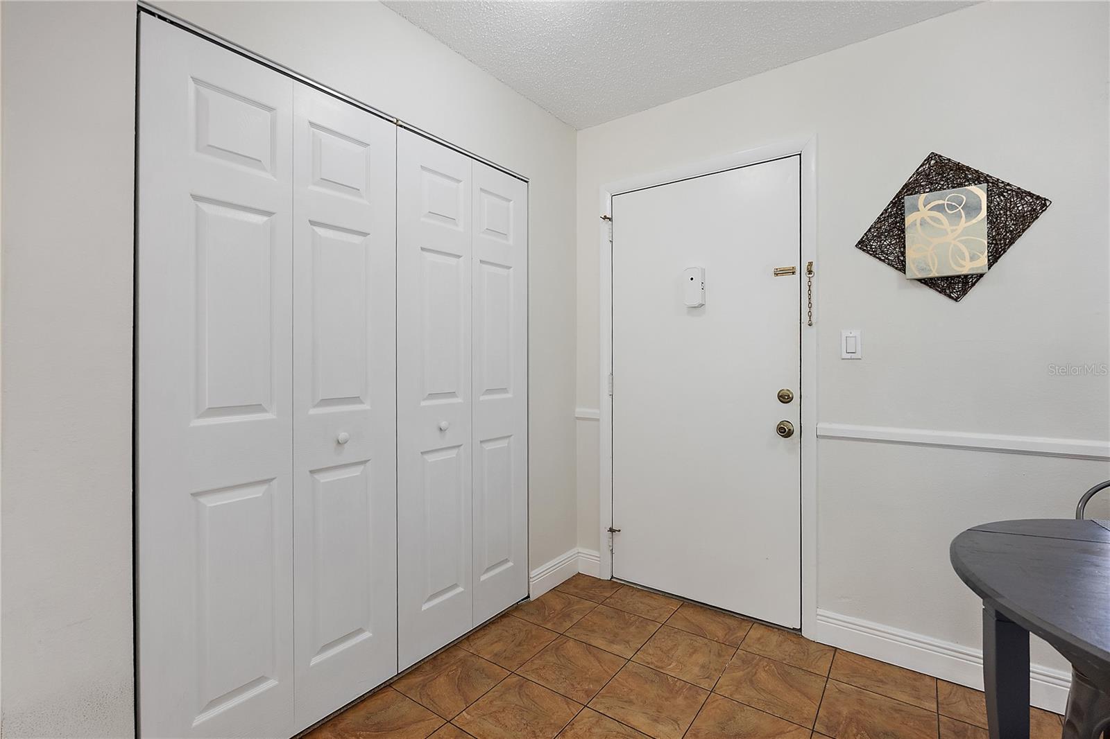 Front Door w/ Coat & Storage Closet