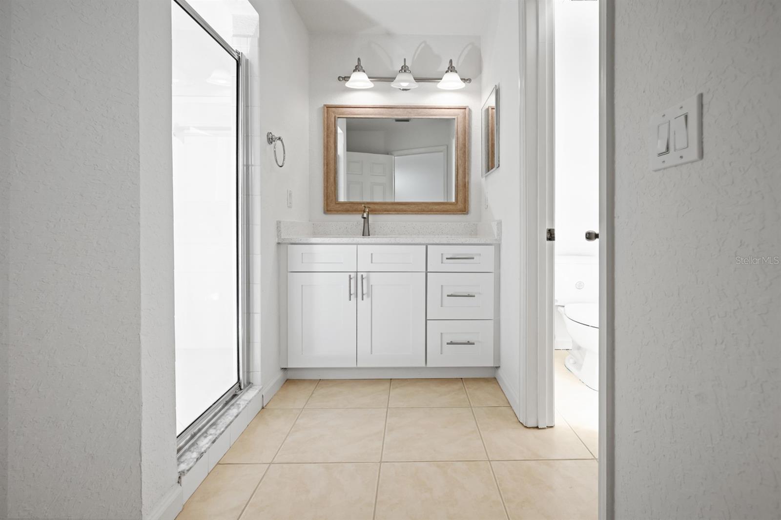 Primary bathroom with Quartz countertops