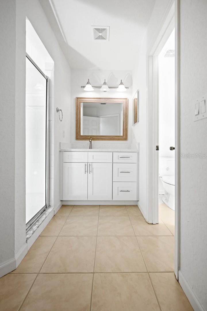 Primary bathroom with Quartz countertops