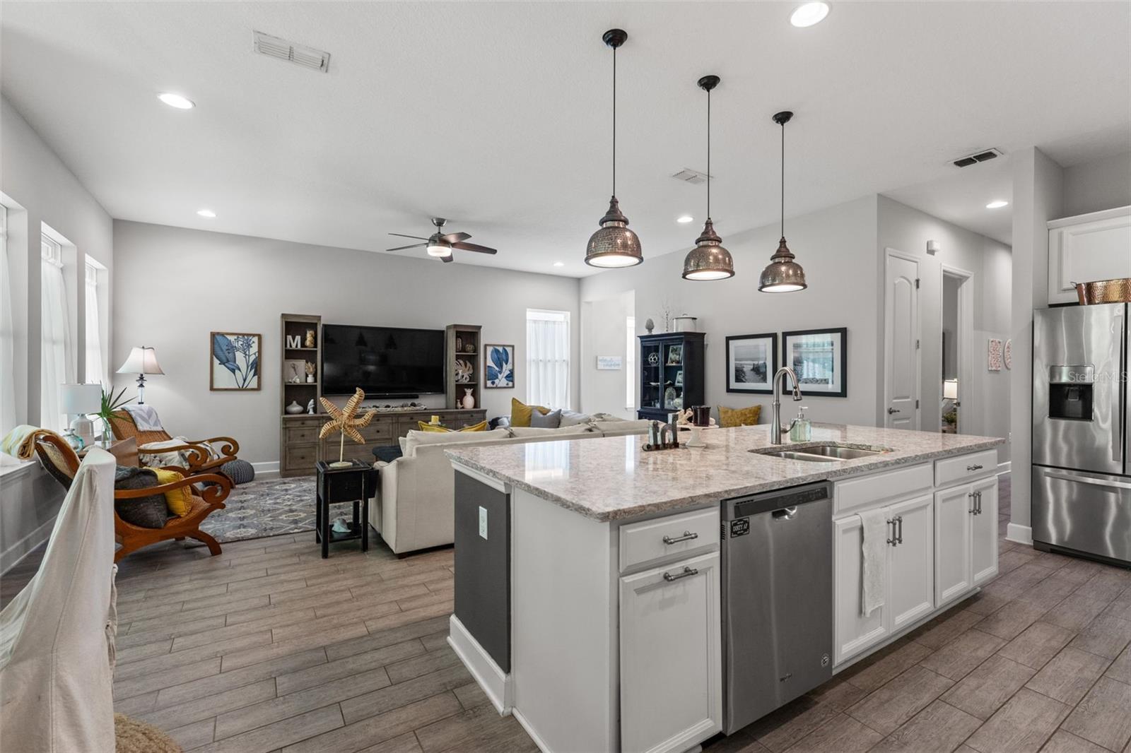 Open-concept design connects the kitchen seamlessly to the main living area, making it ideal for entertaining or family gatherings.