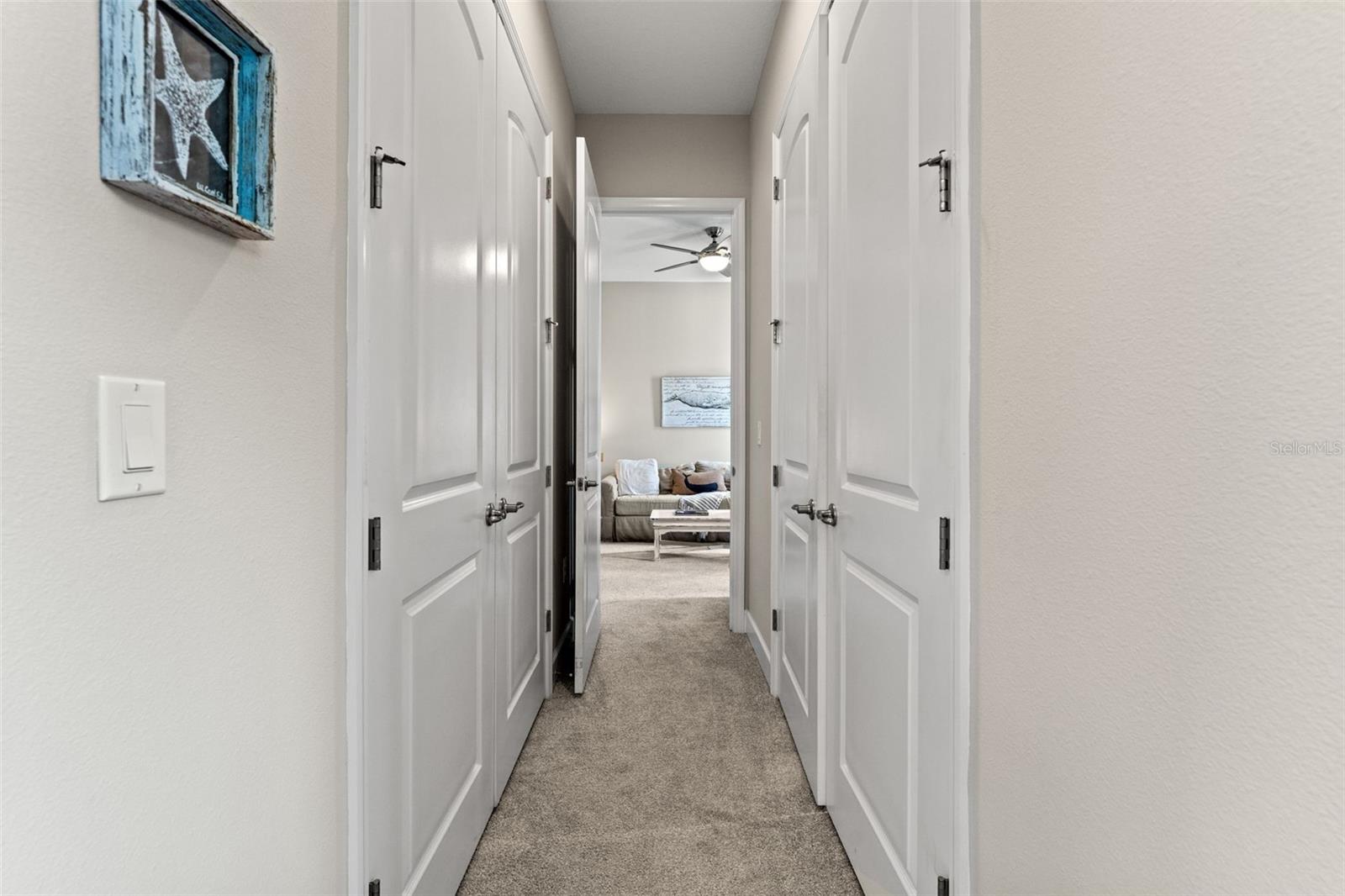 Private corridor connecting secondary bedrooms, offering added separation and quiet within the split floor plan.