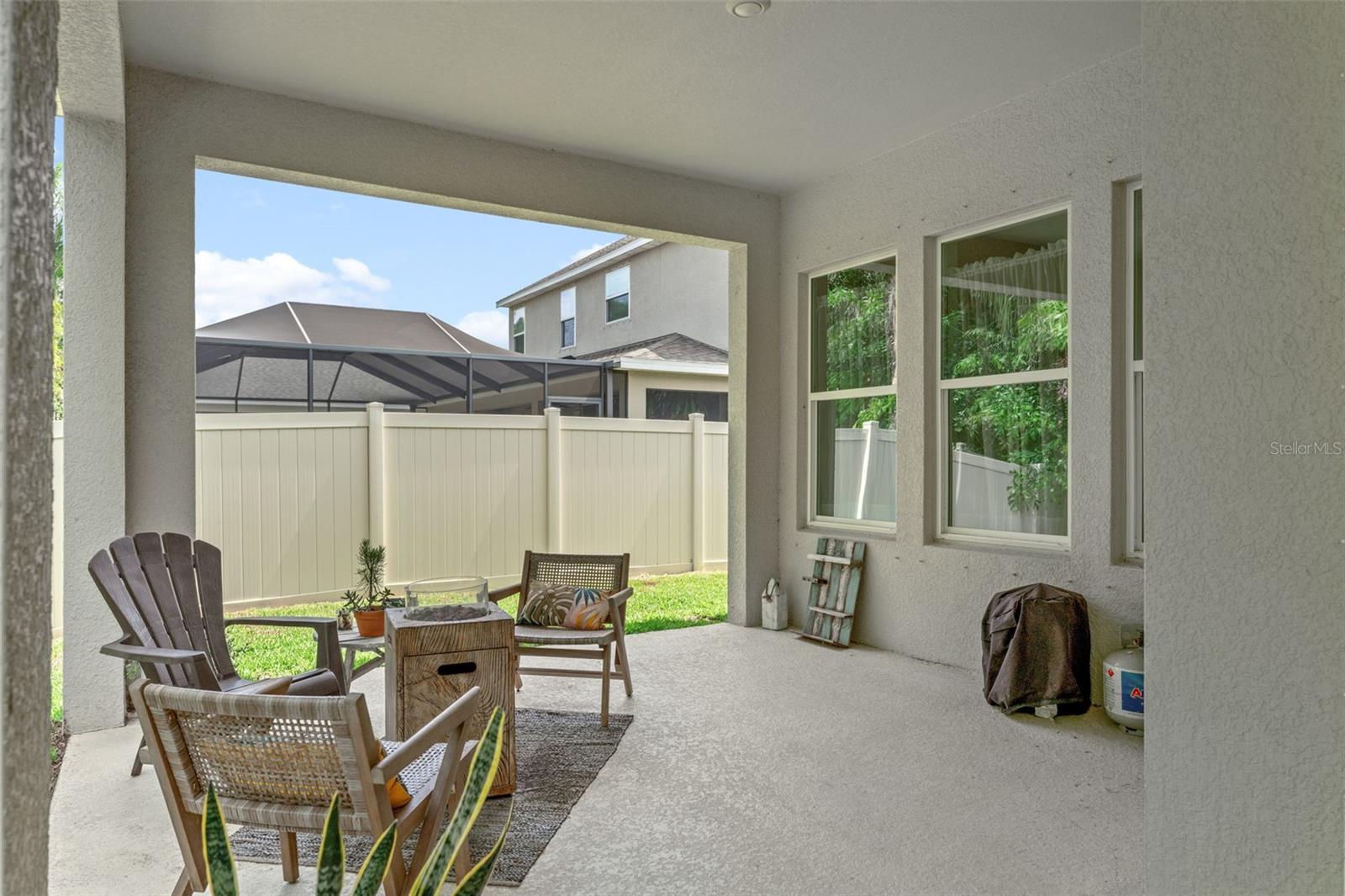 Enjoy Florida living year-round in this private outdoor retreat surrounded by tropical landscaping and fully fenced yard.