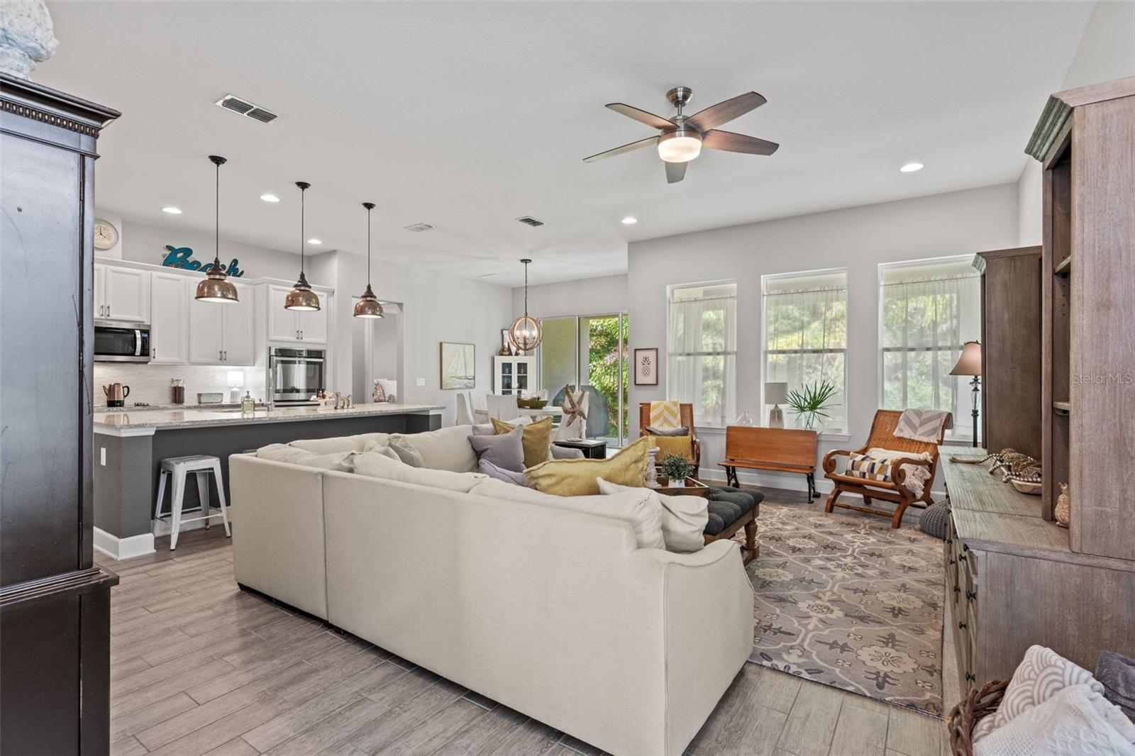 The living room connects effortlessly to the kitchen and dining area, creating an ideal flow for everyday living and gatherings.
