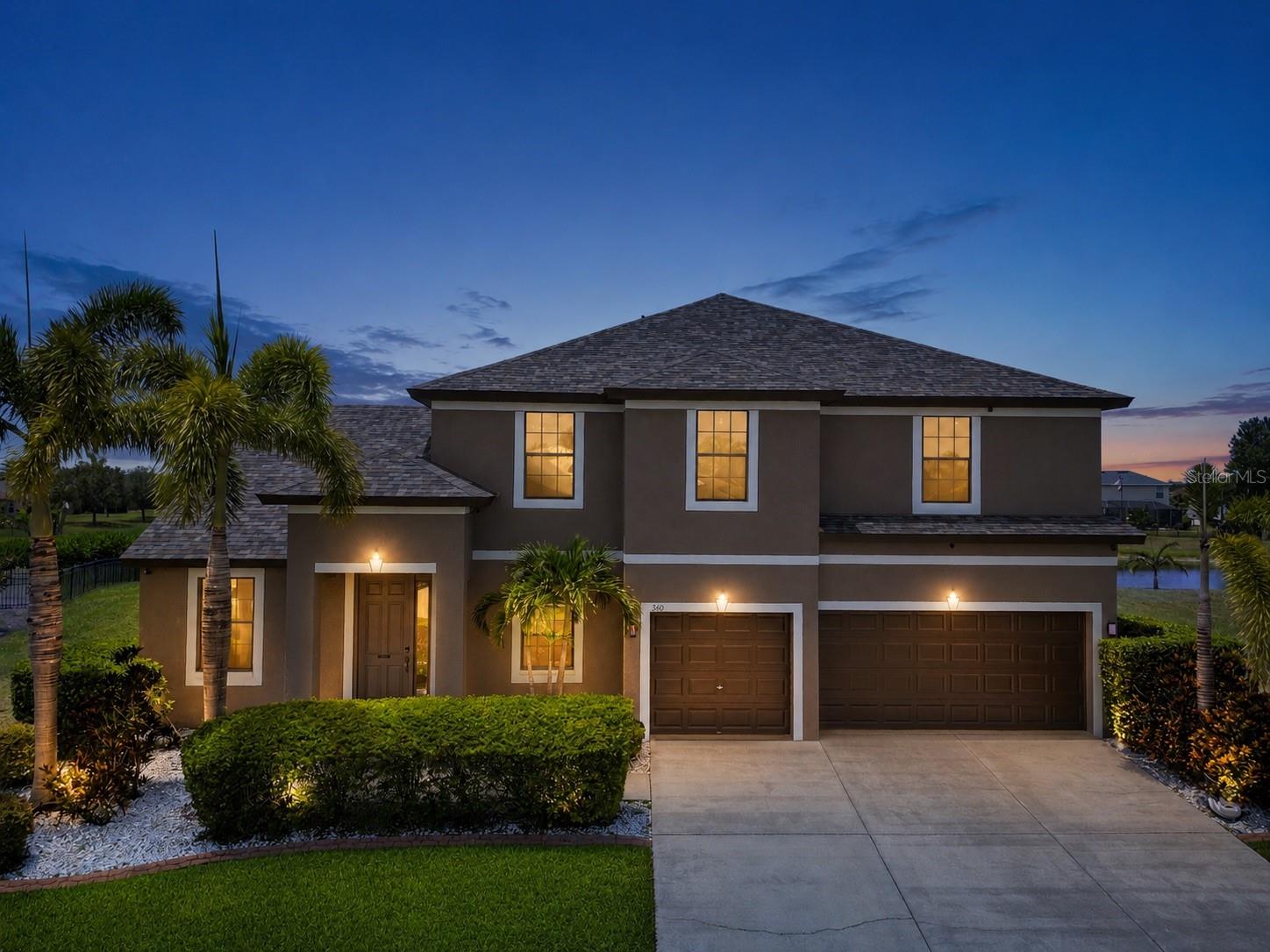 Stunning curb appeal featuring beautifully maintained landscaping and inviting exterior charm.